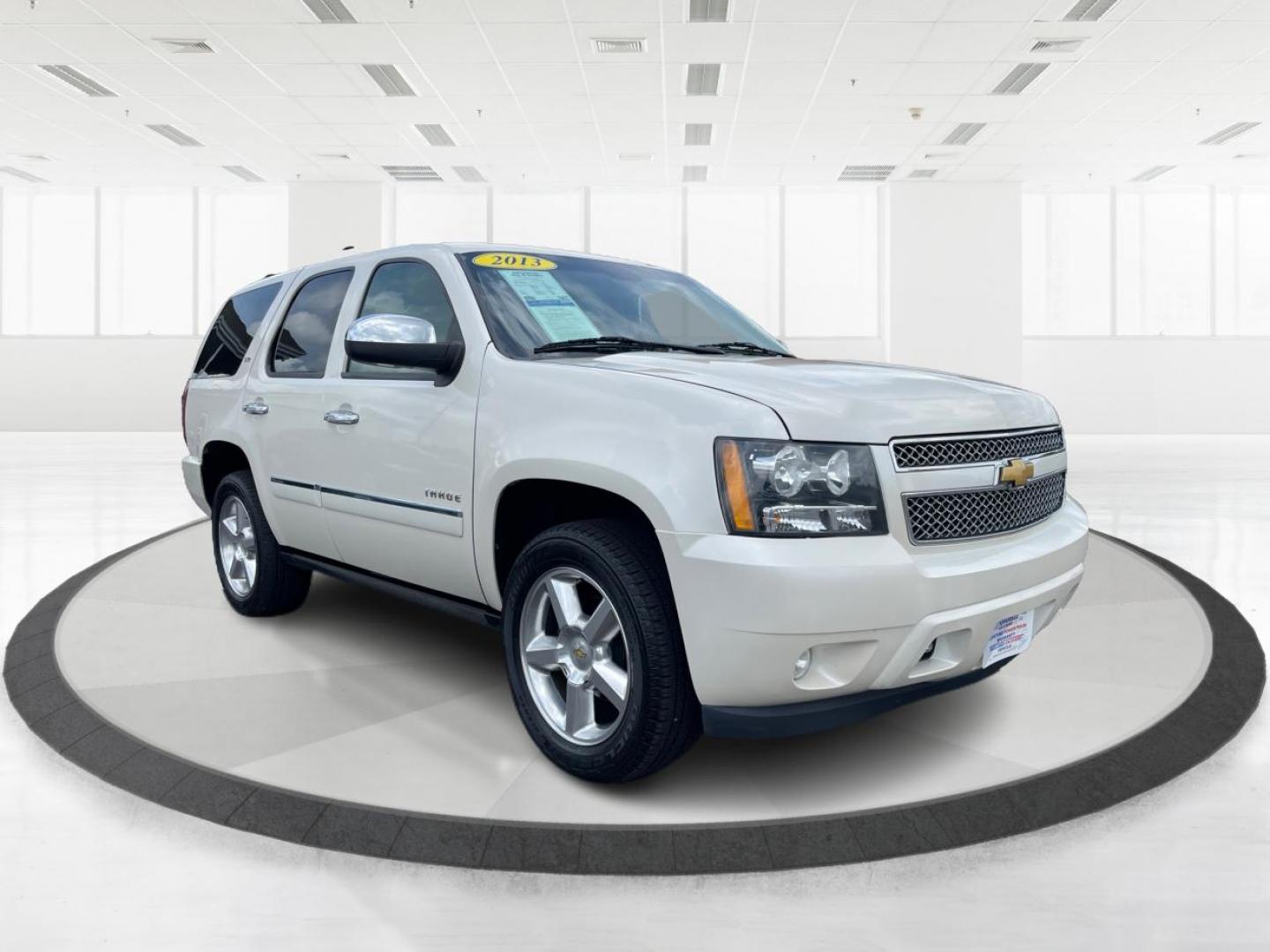 2013 Chevrolet Tahoe LTZ 4WD (1GNSKCE06DR) with an 5.3L V8 OHV 16V FFV engine, 6-Speed Automatic transmission, located at 8750 N County Rd 25A, Piqua, OH, 45356, (937) 908-9800, 40.164391, -84.232513 - Third Row - Photo#0