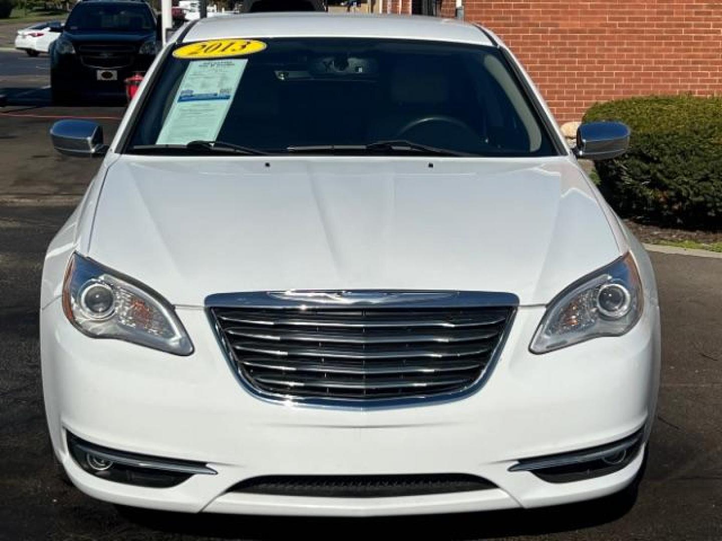 2013 Bright White Chrysler 200 Limited (1C3CCBCG9DN) with an 3.6L V6 DOHC 24V FFV engine, 6-Speed Automatic transmission, located at 1099 N County Rd 25A , Troy, OH, 45373, (937) 908-9800, 40.057079, -84.212883 - Photo#1