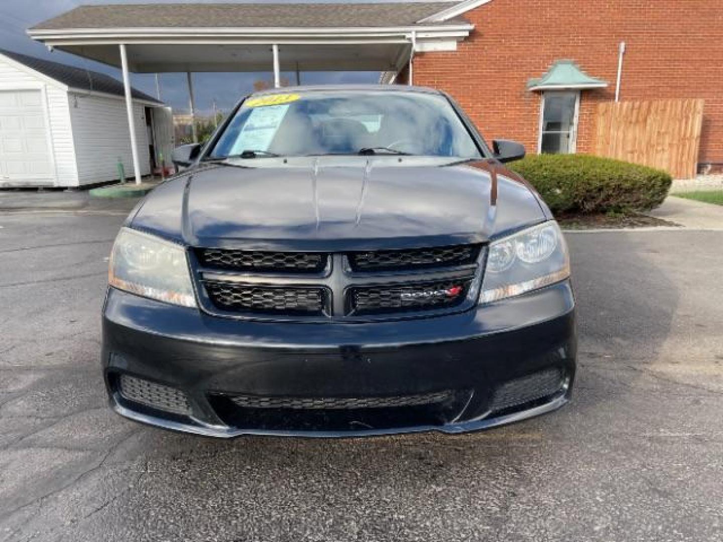 2013 Black Dodge Avenger SE (1C3CDZAG6DN) with an 3.6L V6 DOHC 24V FFV engine, 6-Speed Automatic transmission, located at 1951 S Dayton Lakeview Rd., New Carlisle, OH, 45344, (937) 908-9800, 39.890999, -84.050255 - Photo#1