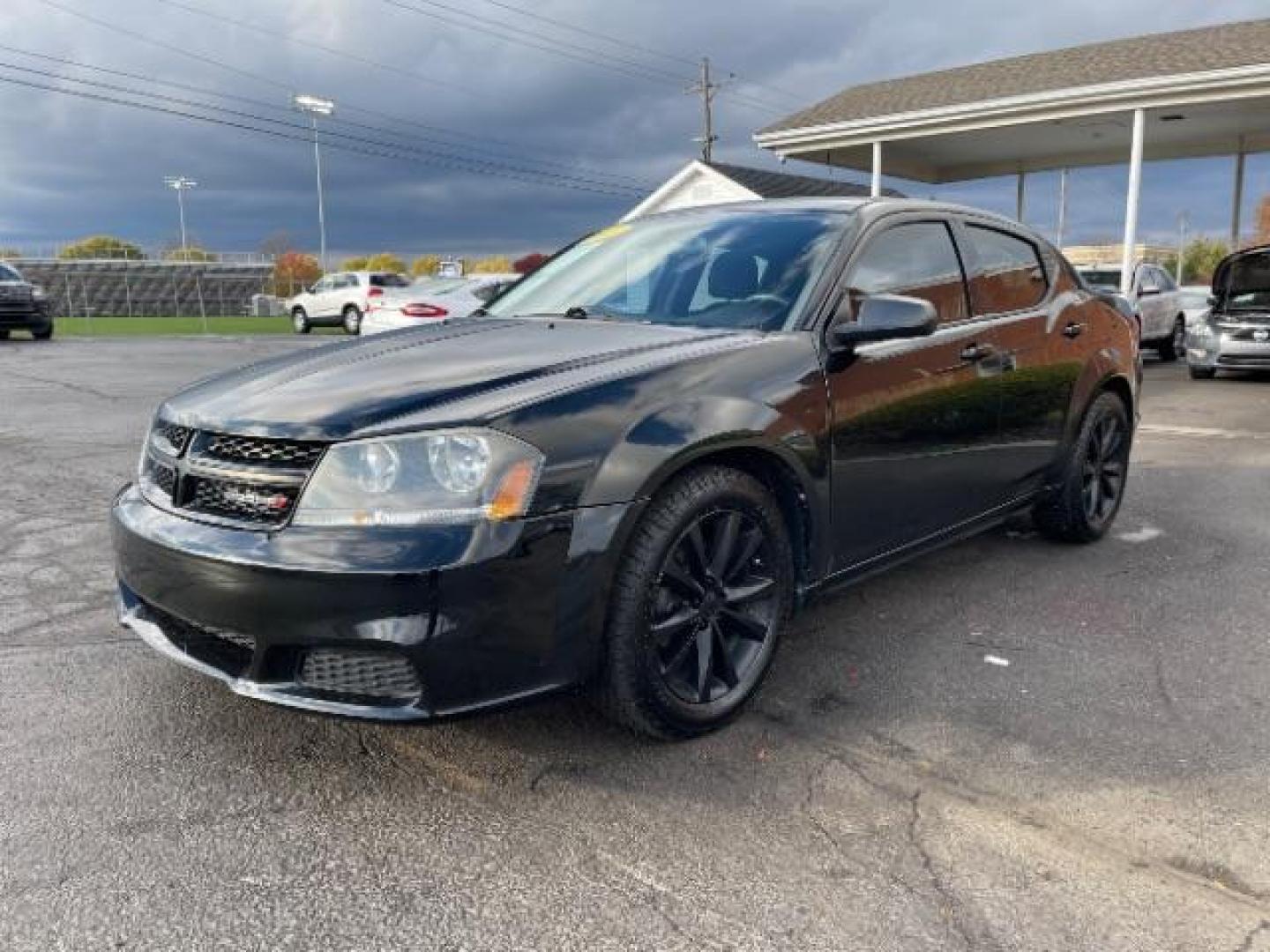 2013 Black Dodge Avenger SE (1C3CDZAG6DN) with an 3.6L V6 DOHC 24V FFV engine, 6-Speed Automatic transmission, located at 1951 S Dayton Lakeview Rd., New Carlisle, OH, 45344, (937) 908-9800, 39.890999, -84.050255 - Photo#2