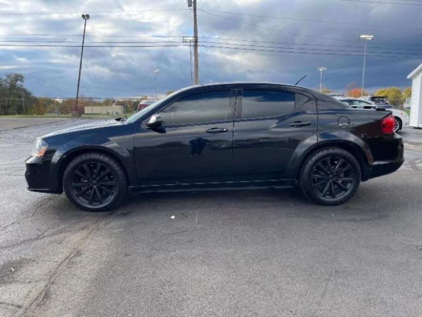 2013 Black Dodge Avenger SE (1C3CDZAG6DN) with an 3.6L V6 DOHC 24V FFV engine, 6-Speed Automatic transmission, located at 1951 S Dayton Lakeview Rd., New Carlisle, OH, 45344, (937) 908-9800, 39.890999, -84.050255 - Photo#3