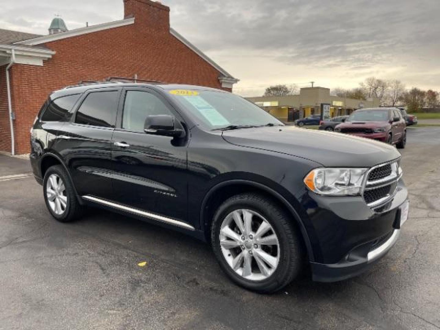 2013 Brilliant Black Crystal Pearl Dodge Durango Crew AWD (1C4RDJDG4DC) with an 3.6L V6 DOHC 24V engine, 5-Speed Automatic transmission, located at 1099 N County Rd 25A , Troy, OH, 45373, (937) 908-9800, 40.057079, -84.212883 - Photo#0