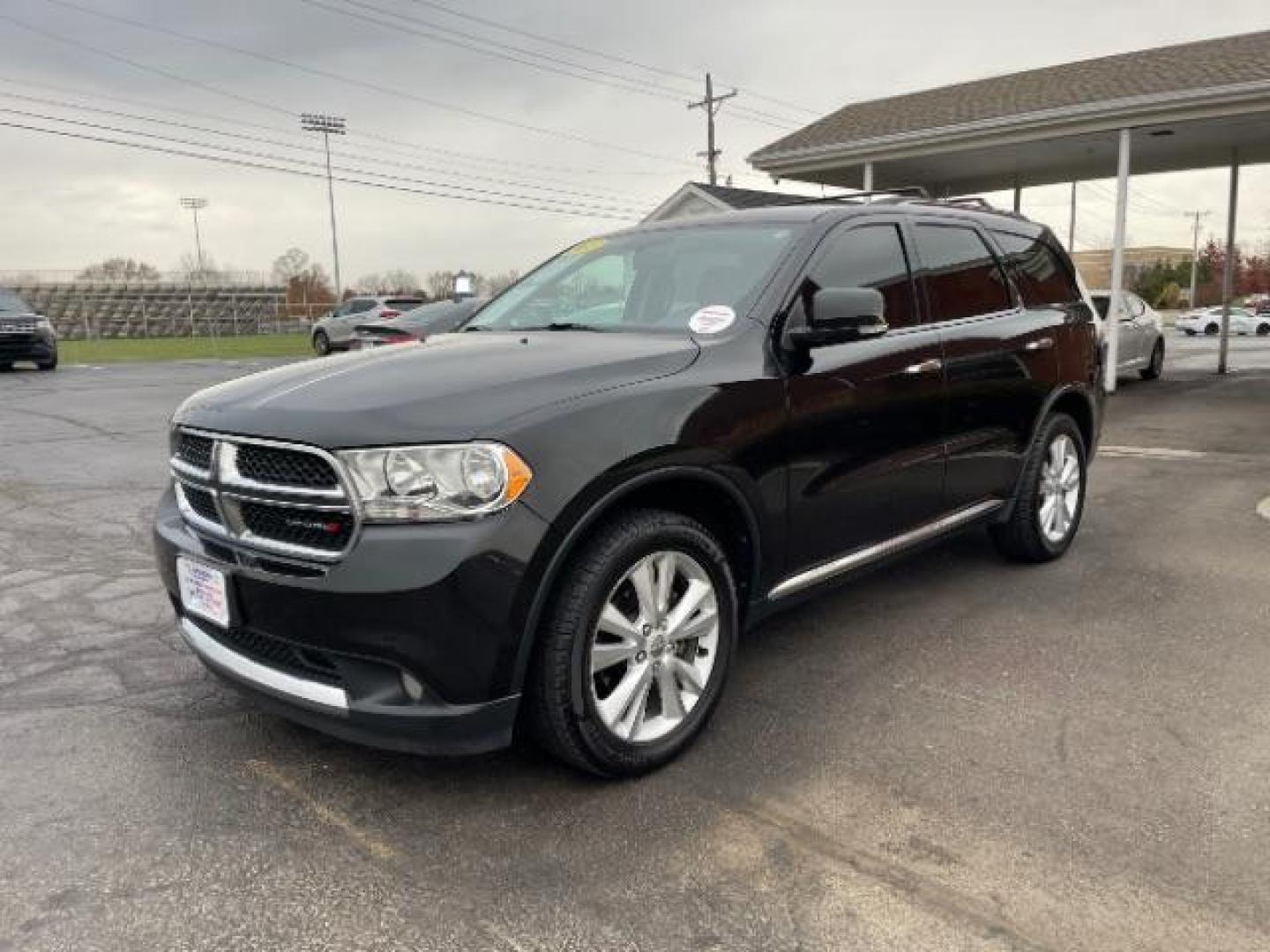 2013 Brilliant Black Crystal Pearl Dodge Durango Crew AWD (1C4RDJDG4DC) with an 3.6L V6 DOHC 24V engine, 5-Speed Automatic transmission, located at 1099 N County Rd 25A , Troy, OH, 45373, (937) 908-9800, 40.057079, -84.212883 - Photo#1