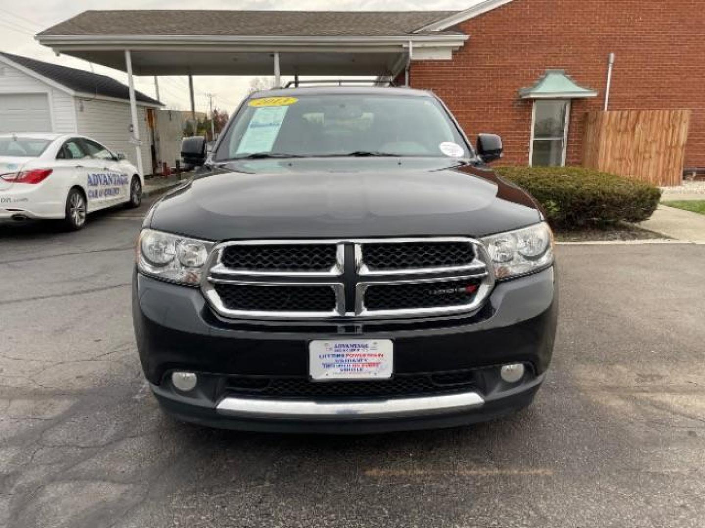 2013 Brilliant Black Crystal Pearl Dodge Durango Crew AWD (1C4RDJDG4DC) with an 3.6L V6 DOHC 24V engine, 5-Speed Automatic transmission, located at 1099 N County Rd 25A , Troy, OH, 45373, (937) 908-9800, 40.057079, -84.212883 - Photo#4