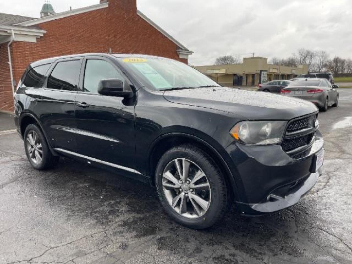 2013 Brilliant Black Crystal Pearl Dodge Durango SXT AWD (1C4RDJAG2DC) with an 3.6L V6 DOHC 24V engine, 5-Speed Automatic transmission, located at 1099 N County Rd 25A , Troy, OH, 45373, (937) 908-9800, 40.057079, -84.212883 - Photo#0