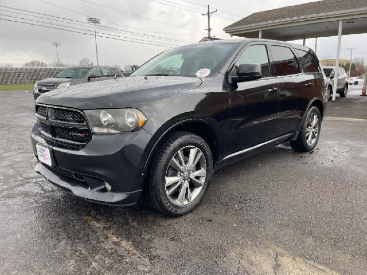 2013 Brilliant Black Crystal Pearl Dodge Durango SXT AWD (1C4RDJAG2DC) with an 3.6L V6 DOHC 24V engine, 5-Speed Automatic transmission, located at 1099 N County Rd 25A , Troy, OH, 45373, (937) 908-9800, 40.057079, -84.212883 - Photo#1