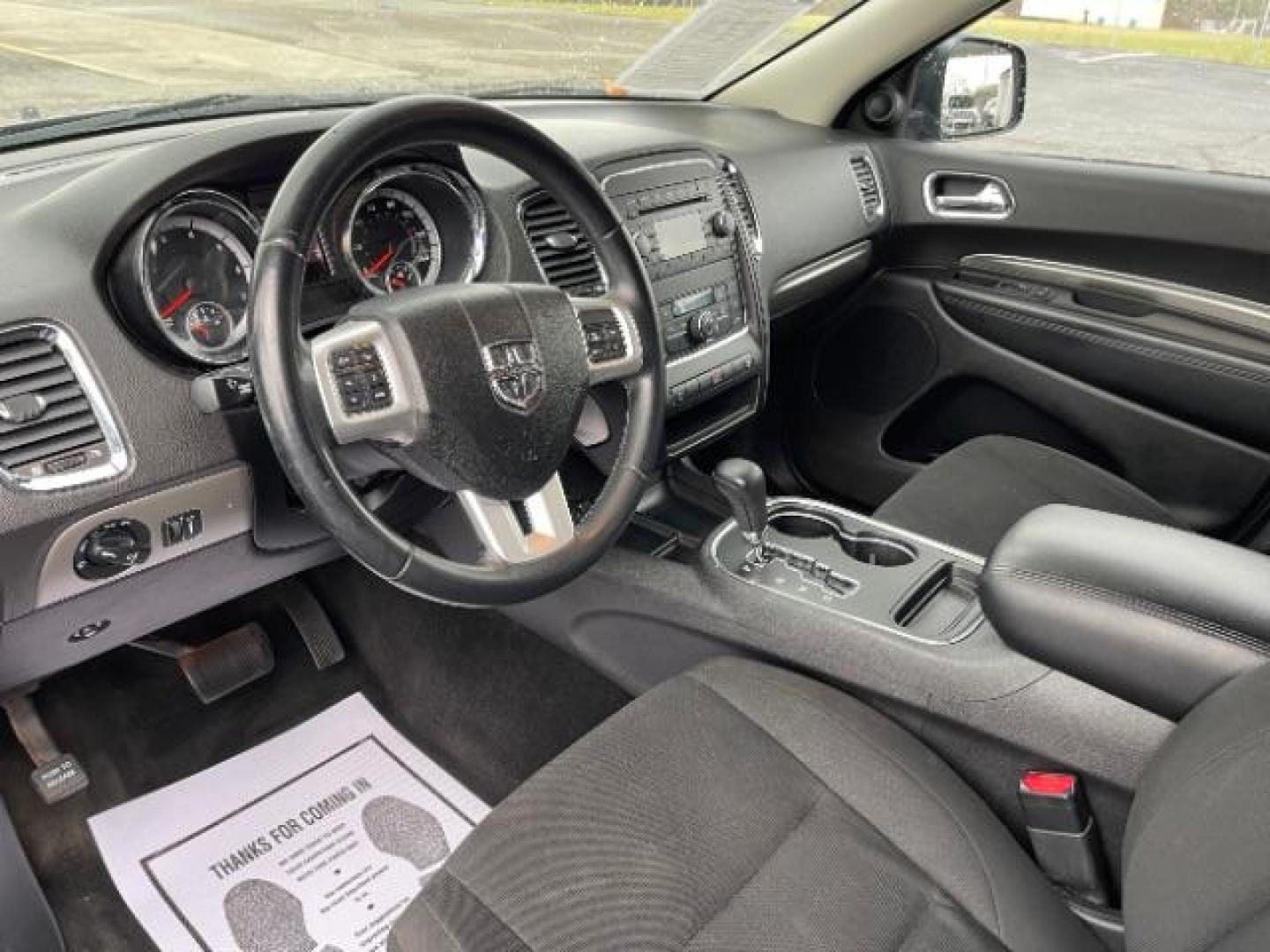 2013 Brilliant Black Crystal Pearl Dodge Durango SXT AWD (1C4RDJAG2DC) with an 3.6L V6 DOHC 24V engine, 5-Speed Automatic transmission, located at 1099 N County Rd 25A , Troy, OH, 45373, (937) 908-9800, 40.057079, -84.212883 - Photo#5