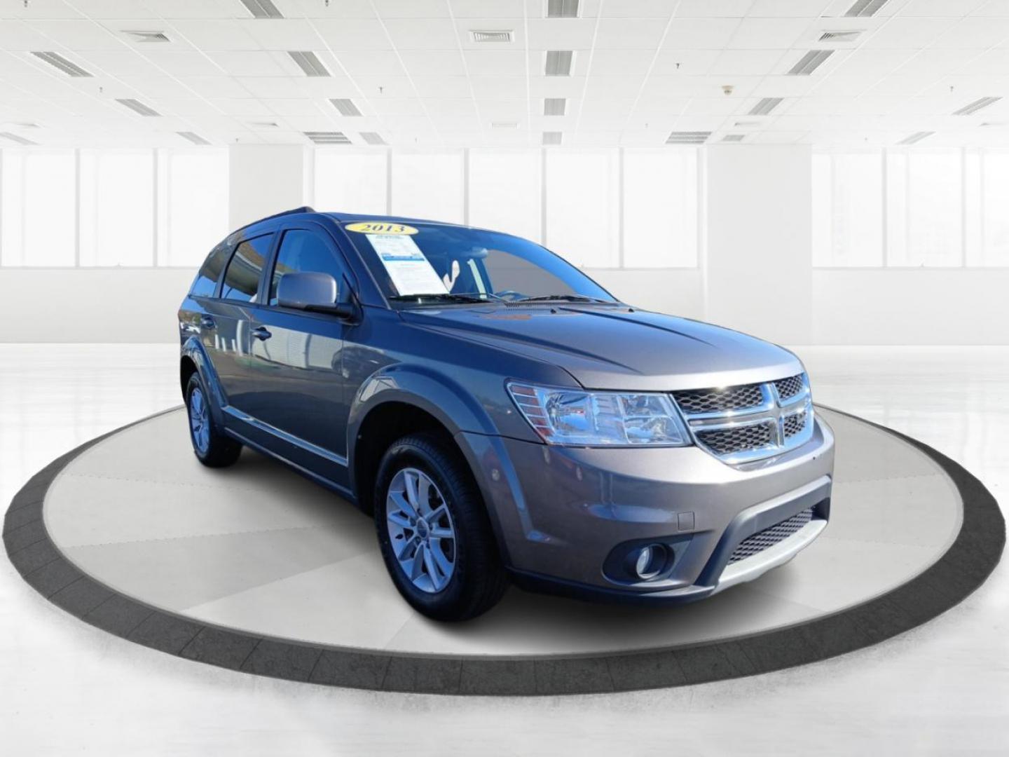 2013 Storm Grey Pearl Dodge Journey SXT (3C4PDCBG0DT) with an 3.6L V6 DOHC 24V engine, 6-Speed Automatic transmission, located at 880 E. National Road, Vandalia, OH, 45377, (937) 908-9800, 39.891918, -84.183594 - Photo#0