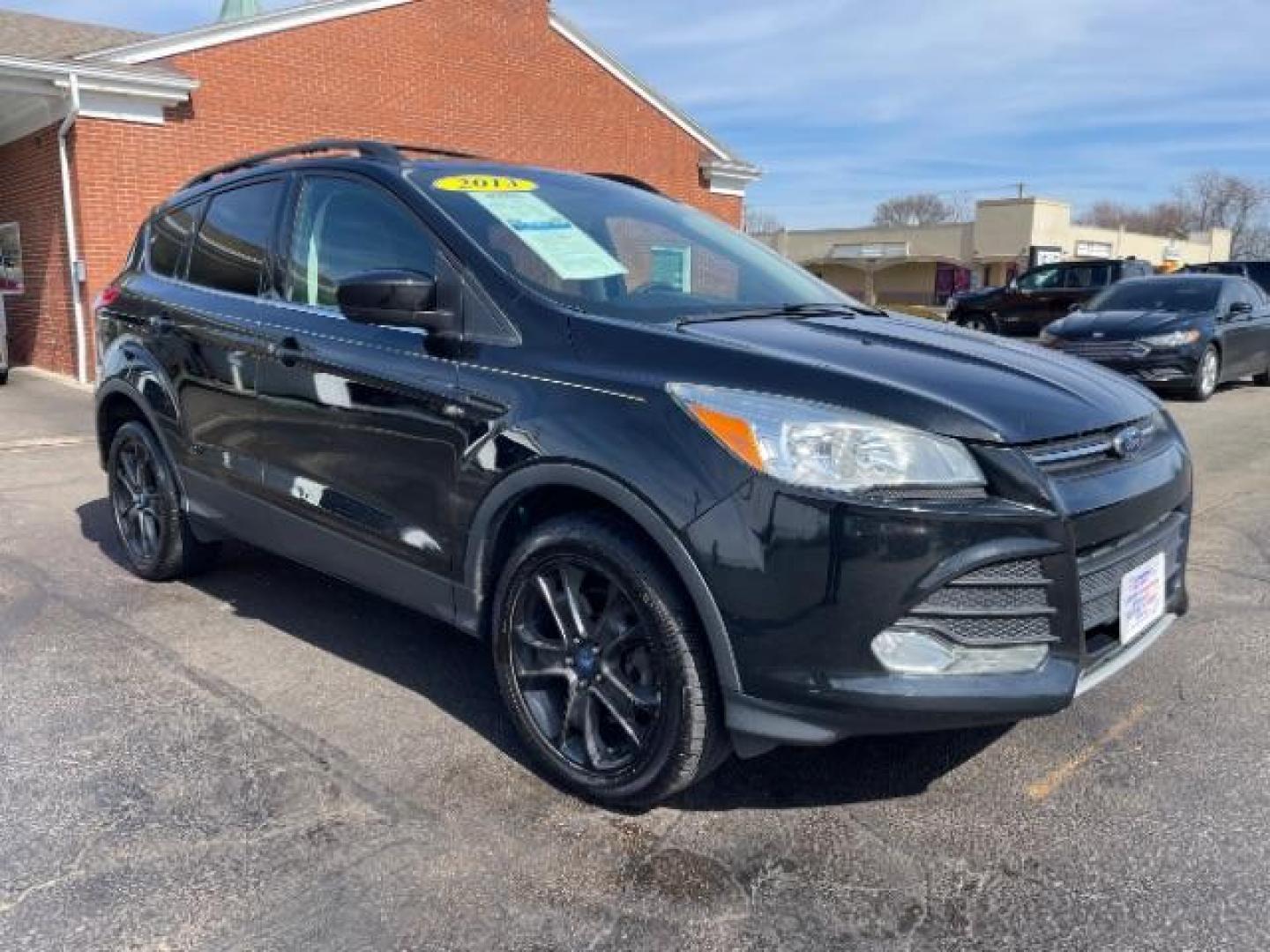 2013 Tuxedo Black Ford Escape SE 4WD (1FMCU9G96DU) with an 2.0L L4 DOHC 16V engine, 6-Speed Automatic transmission, located at 1184 Kauffman Ave, Fairborn, OH, 45324, (937) 908-9800, 39.807072, -84.030914 - Photo#0