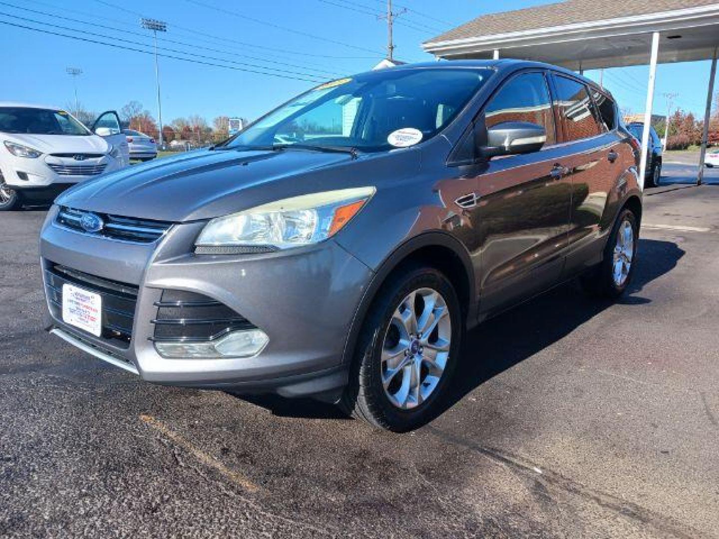 2013 Sterling Grey Metallic Ford Escape SEL 4WD (1FMCU9H94DU) with an 2.0L L4 DOHC 16V engine, 6-Speed Automatic transmission, located at 1951 S Dayton Lakeview Rd., New Carlisle, OH, 45344, (937) 908-9800, 39.890999, -84.050255 - Photo#2