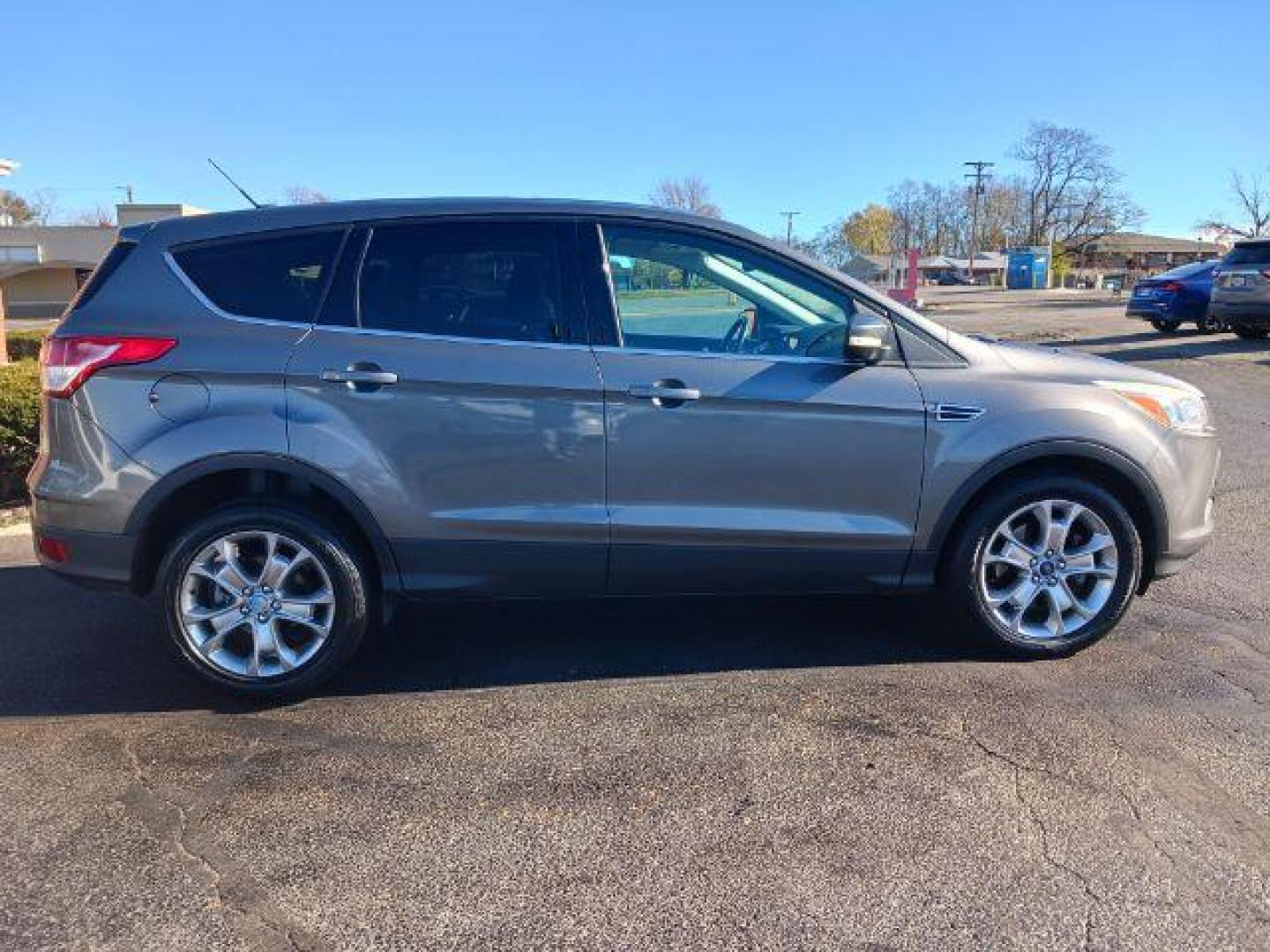 2013 Sterling Grey Metallic Ford Escape SEL 4WD (1FMCU9H94DU) with an 2.0L L4 DOHC 16V engine, 6-Speed Automatic transmission, located at 1951 S Dayton Lakeview Rd., New Carlisle, OH, 45344, (937) 908-9800, 39.890999, -84.050255 - Photo#4