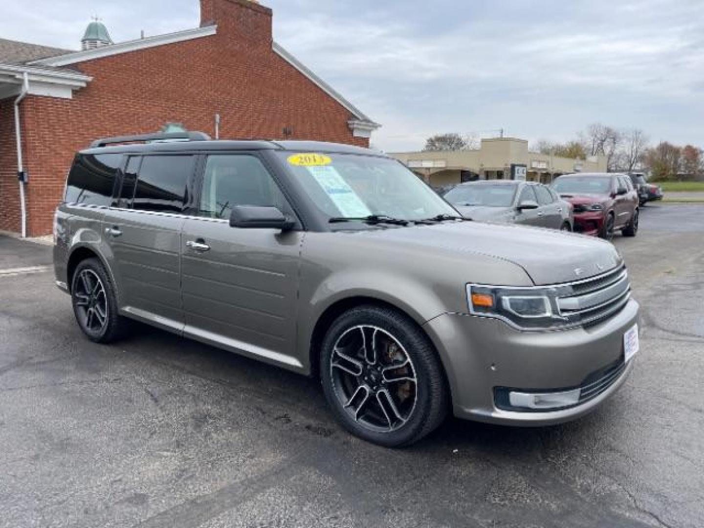 2013 Mineral Gray Metallic Ford Flex Limited AWD (2FMHK6DT2DB) with an 3.5L V6 DOHC 24V engine, 6-Speed Automatic Overdrive transmission, located at 1099 N County Rd 25A , Troy, OH, 45373, (937) 908-9800, 40.057079, -84.212883 - Photo#0