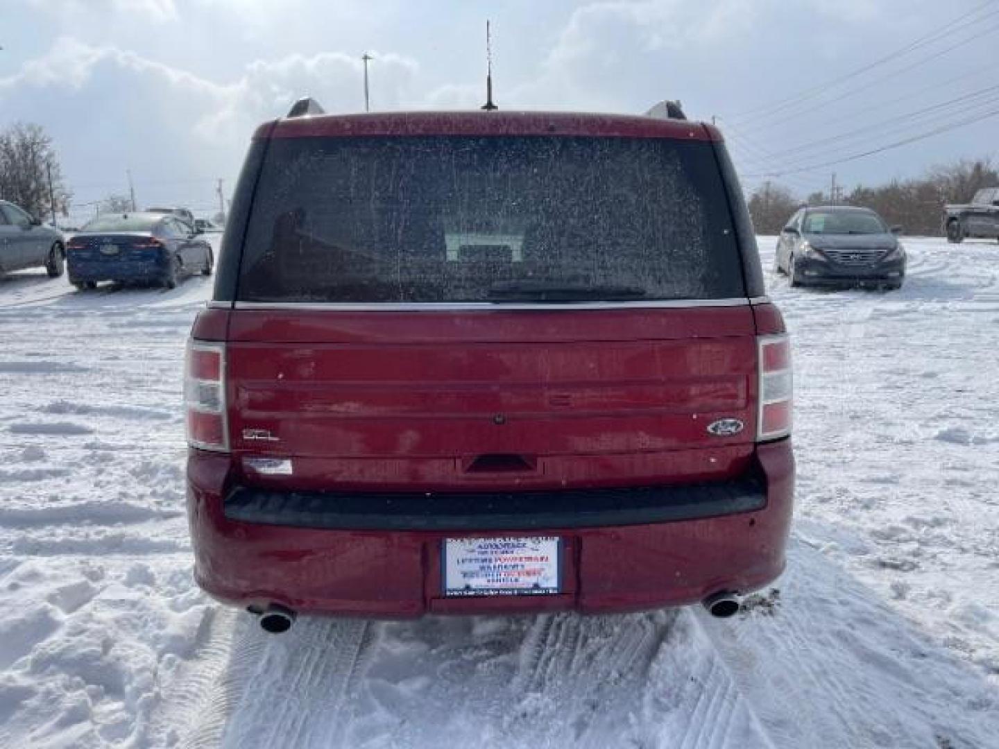 2013 Ruby Red Metallic Tinted Ford Flex SEL FWD (2FMGK5C84DB) with an 3.5L V6 DOHC 24V engine, 6-Speed Automatic Overdrive transmission, located at 1099 N County Rd 25A , Troy, OH, 45373, (937) 908-9800, 40.057079, -84.212883 - Photo#3