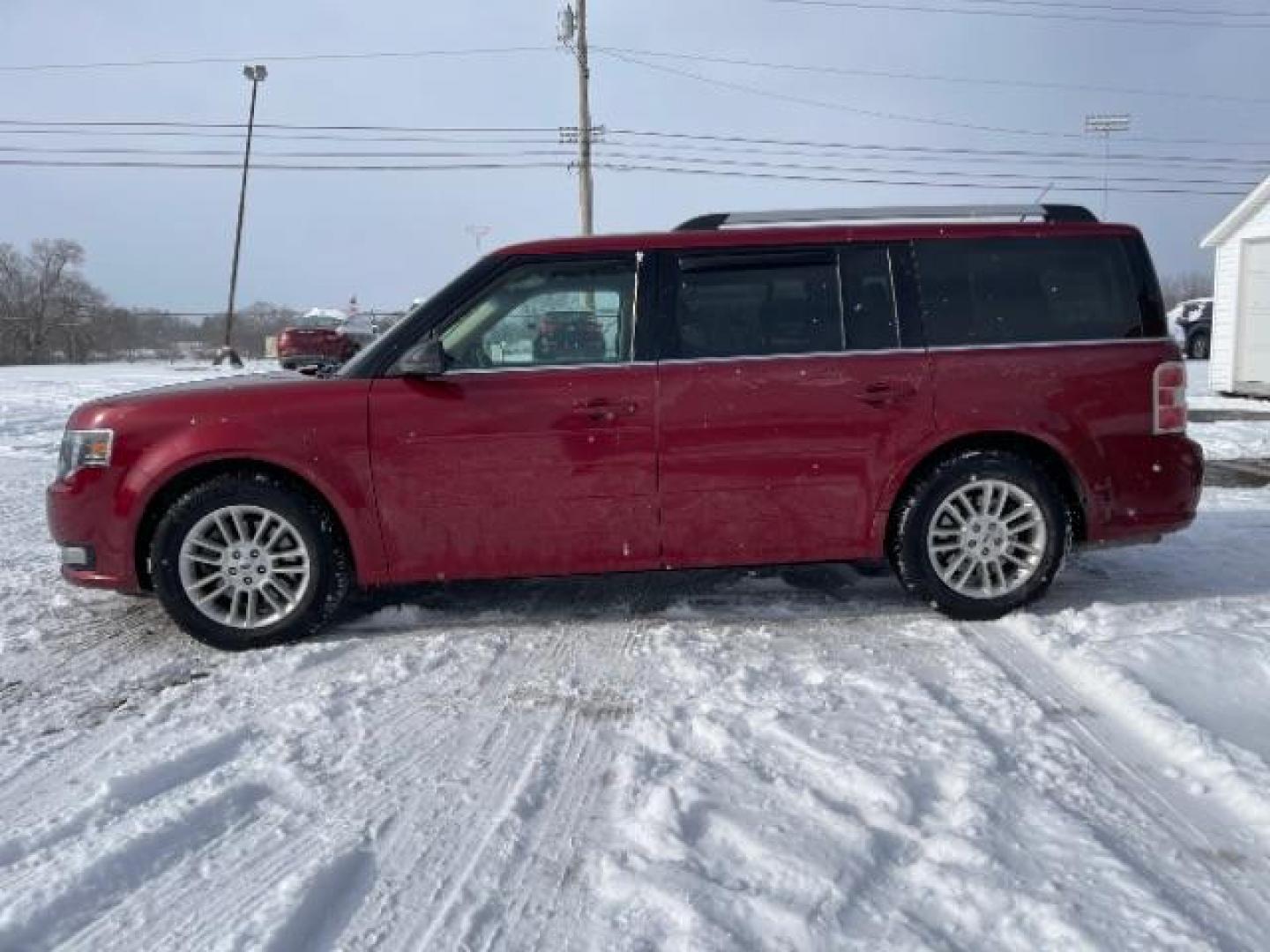 2013 Ruby Red Metallic Tinted Ford Flex SEL FWD (2FMGK5C84DB) with an 3.5L V6 DOHC 24V engine, 6-Speed Automatic Overdrive transmission, located at 1099 N County Rd 25A , Troy, OH, 45373, (937) 908-9800, 40.057079, -84.212883 - Photo#4