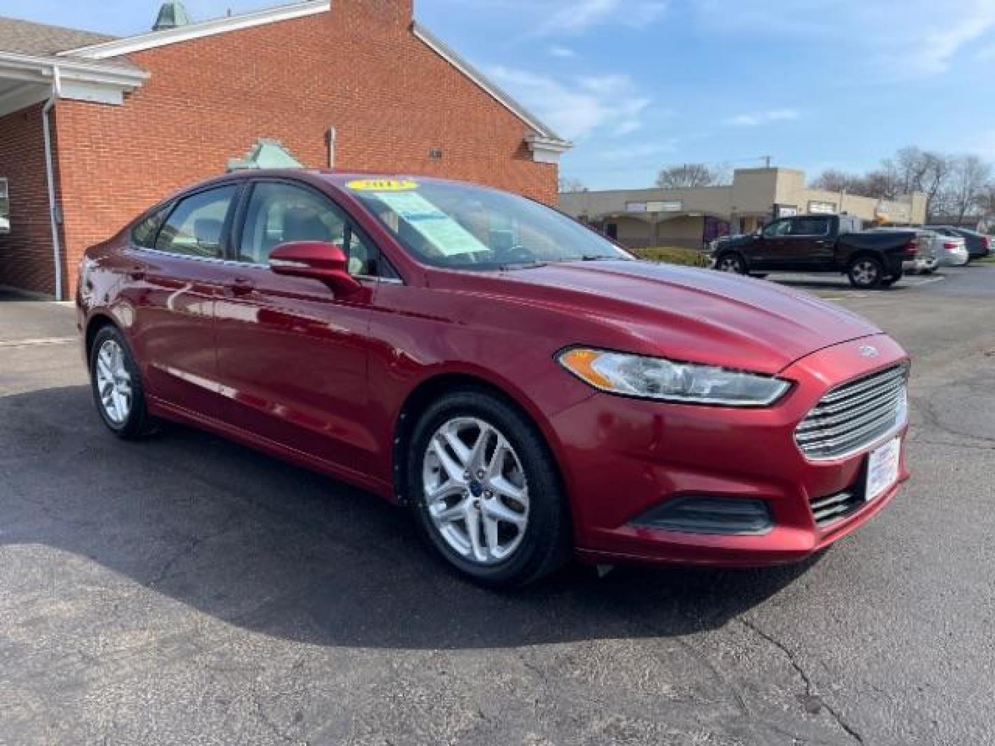 2013 Ruby Red Met Tinted CC Ford Fusion SE (3FA6P0H7XDR) with an 2.5L L4 DOHC 16V engine, located at 1099 N County Rd 25A , Troy, OH, 45373, (937) 908-9800, 40.057079, -84.212883 - Photo#0