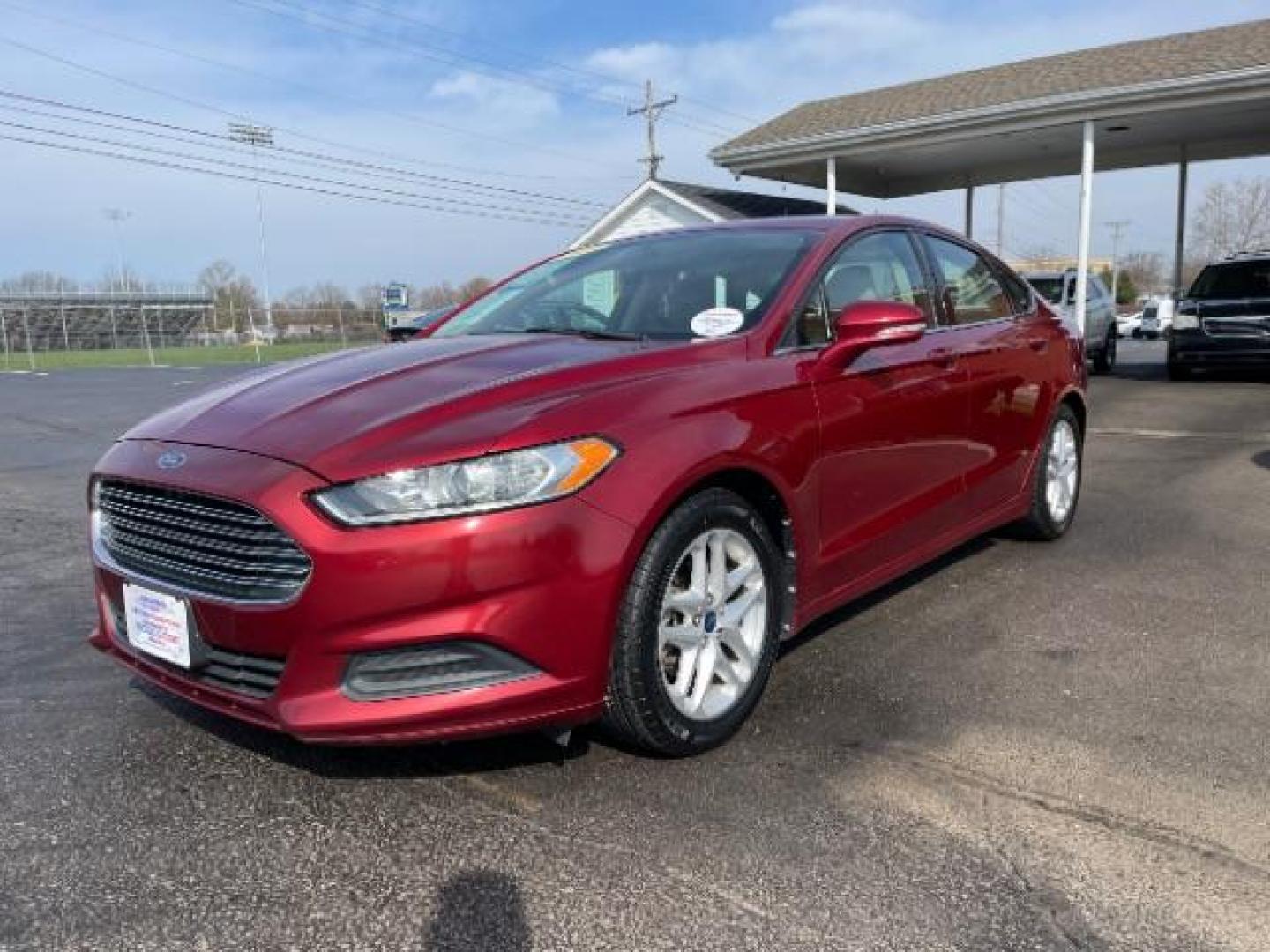 2013 Ruby Red Met Tinted CC Ford Fusion SE (3FA6P0H7XDR) with an 2.5L L4 DOHC 16V engine, located at 1099 N County Rd 25A , Troy, OH, 45373, (937) 908-9800, 40.057079, -84.212883 - Photo#1