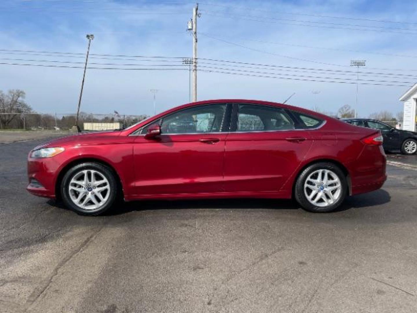 2013 Ruby Red Met Tinted CC Ford Fusion SE (3FA6P0H7XDR) with an 2.5L L4 DOHC 16V engine, located at 1099 N County Rd 25A , Troy, OH, 45373, (937) 908-9800, 40.057079, -84.212883 - Photo#2