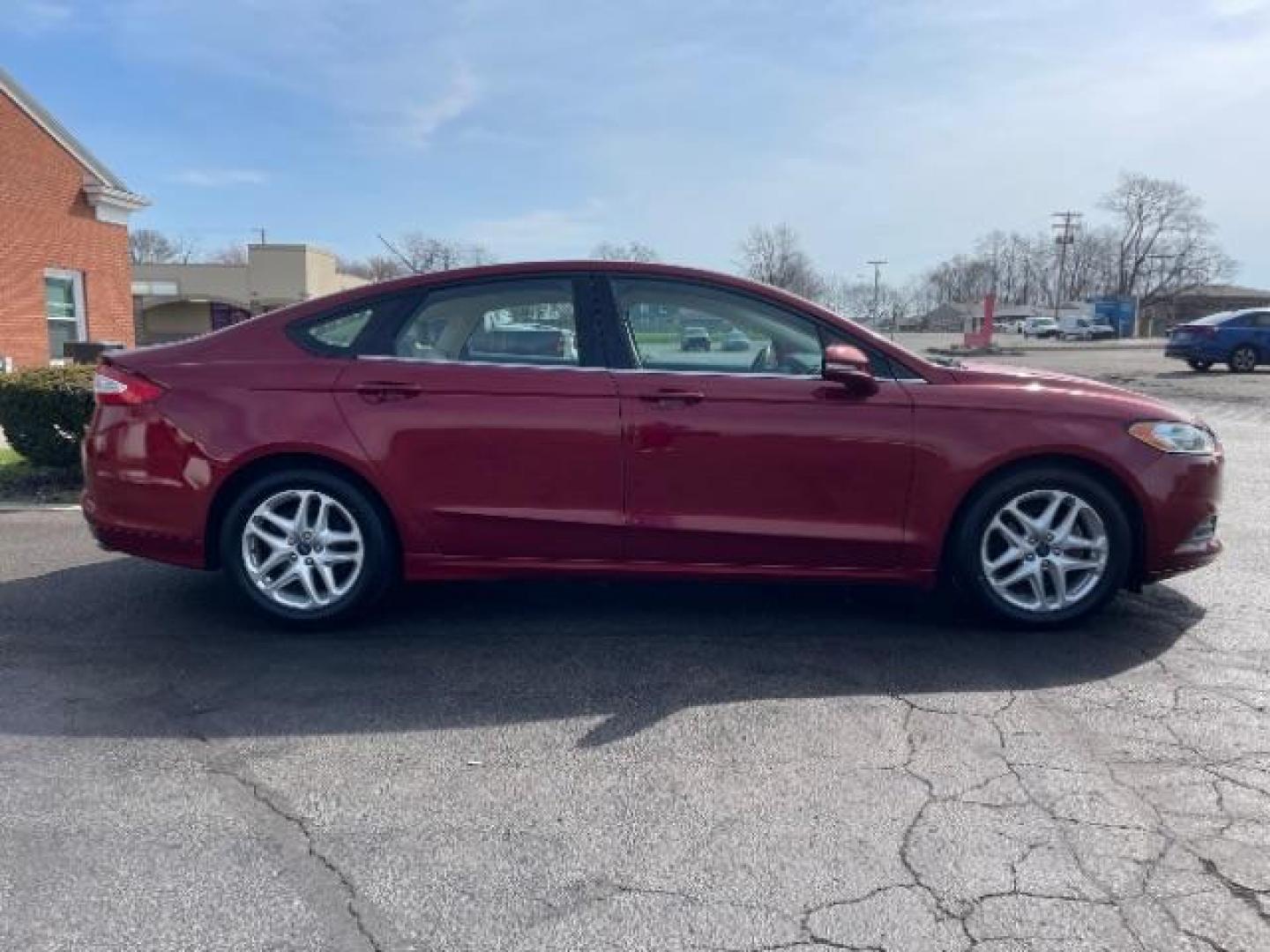 2013 Ruby Red Met Tinted CC Ford Fusion SE (3FA6P0H7XDR) with an 2.5L L4 DOHC 16V engine, located at 1099 N County Rd 25A , Troy, OH, 45373, (937) 908-9800, 40.057079, -84.212883 - Photo#3