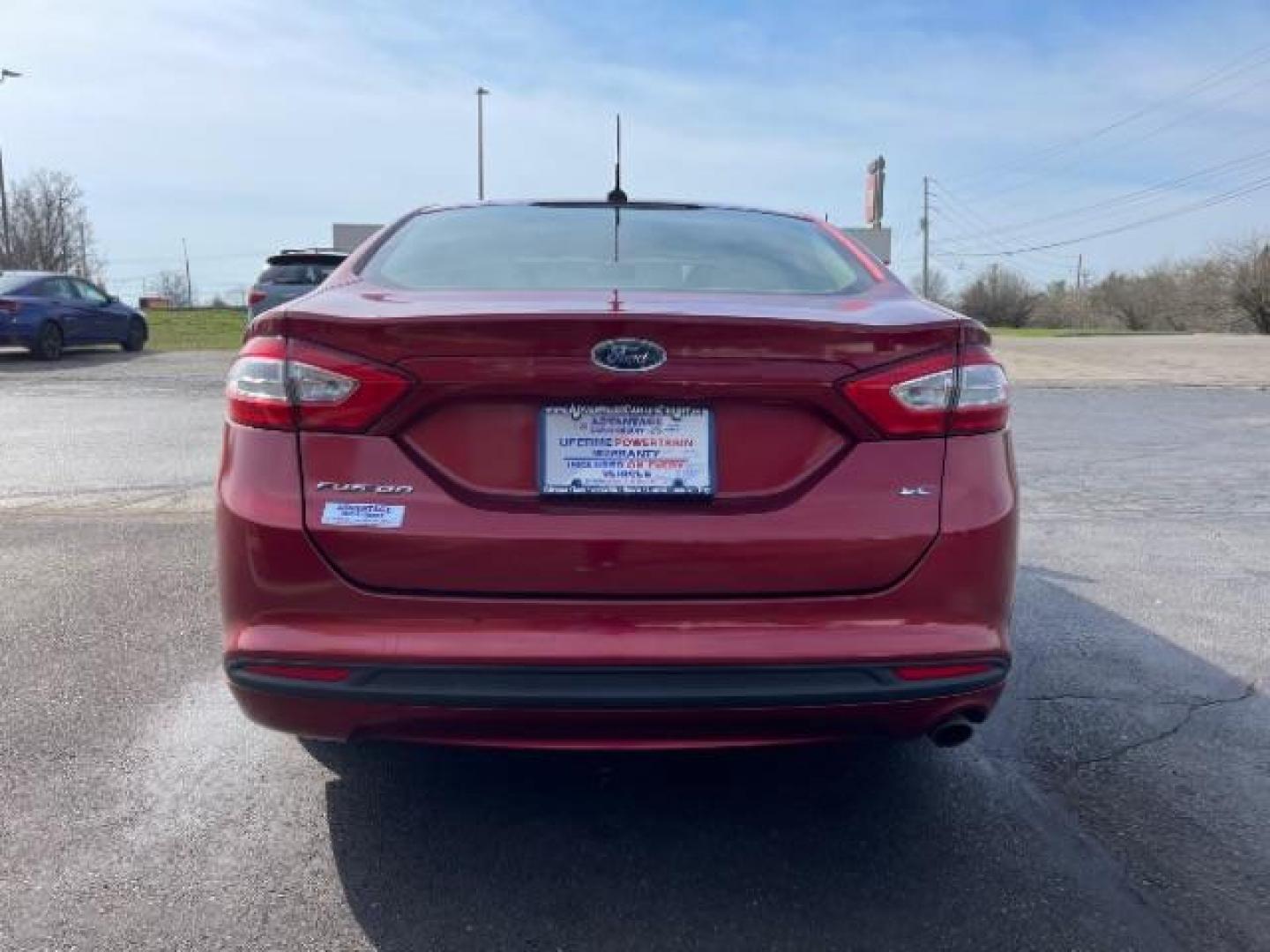 2013 Ruby Red Met Tinted CC Ford Fusion SE (3FA6P0H7XDR) with an 2.5L L4 DOHC 16V engine, located at 1099 N County Rd 25A , Troy, OH, 45373, (937) 908-9800, 40.057079, -84.212883 - Photo#4