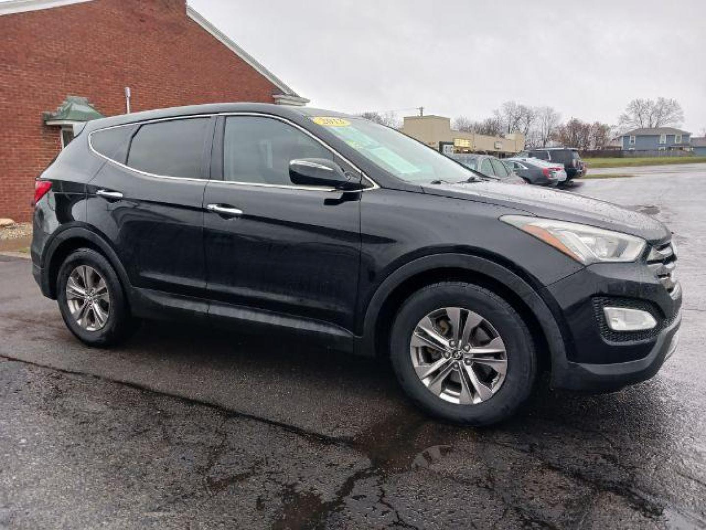 2013 Twilight Black Hyundai Santa Fe Sport 2.4 FWD (5XYZU3LB3DG) with an 2.4L L4 DOHC 16V engine, 6-Speed Automatic transmission, located at 401 Woodman Dr, Riverside, OH, 45431, (937) 908-9800, 39.760899, -84.123421 - Photo#0