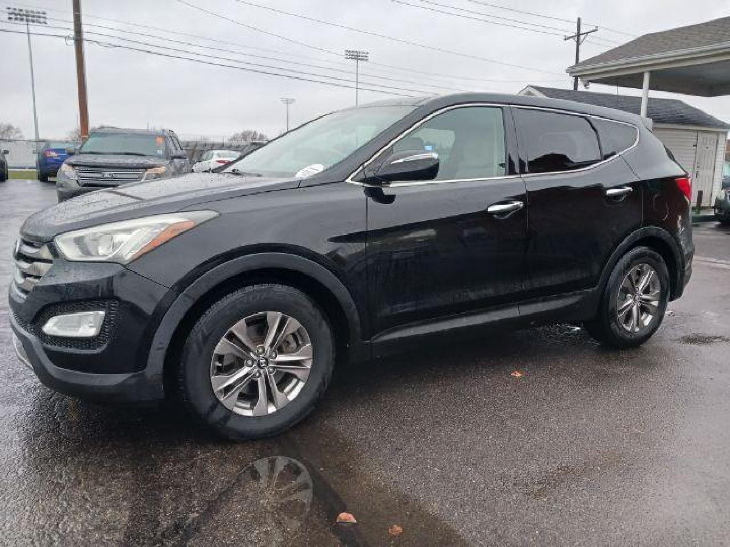 2013 Twilight Black Hyundai Santa Fe Sport 2.4 FWD (5XYZU3LB3DG) with an 2.4L L4 DOHC 16V engine, 6-Speed Automatic transmission, located at 401 Woodman Dr, Riverside, OH, 45431, (937) 908-9800, 39.760899, -84.123421 - Photo#2