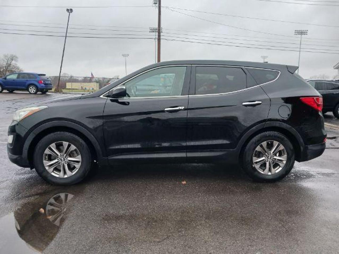 2013 Twilight Black Hyundai Santa Fe Sport 2.4 FWD (5XYZU3LB3DG) with an 2.4L L4 DOHC 16V engine, 6-Speed Automatic transmission, located at 401 Woodman Dr, Riverside, OH, 45431, (937) 908-9800, 39.760899, -84.123421 - Photo#3