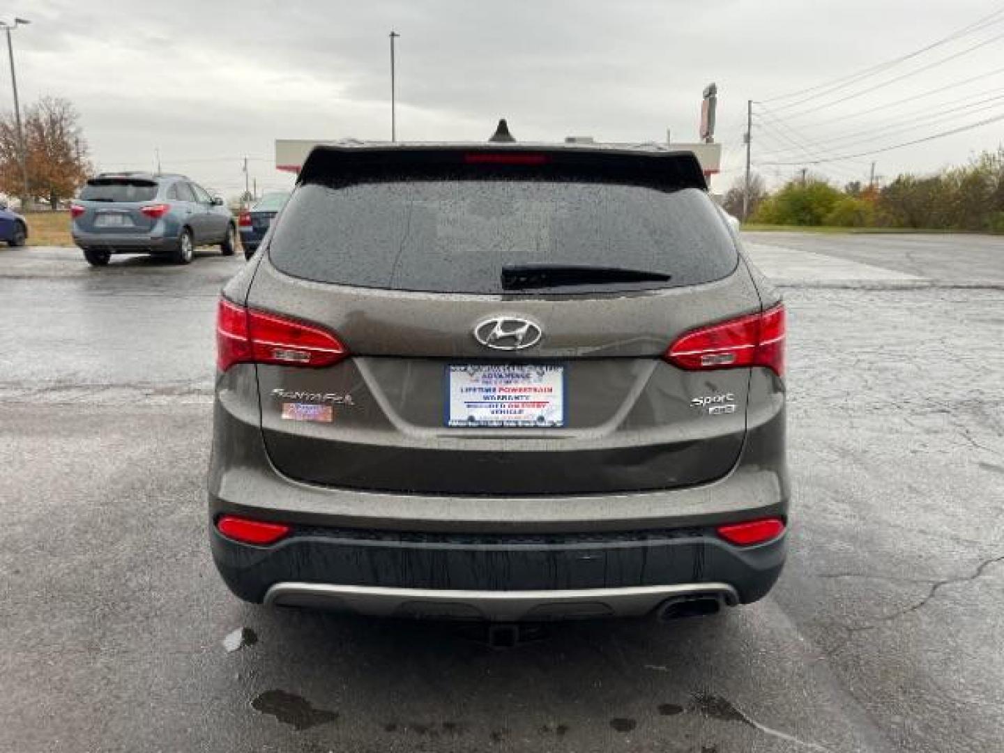 2013 Mineral Gray Hyundai Santa Fe Sport 2.4 AWD (5XYZUDLBXDG) with an 2.4L L4 DOHC 16V engine, 6-Speed Automatic transmission, located at 1230 East Main St, Xenia, OH, 45385, (937) 908-9800, 39.688026, -83.910172 - Photo#4