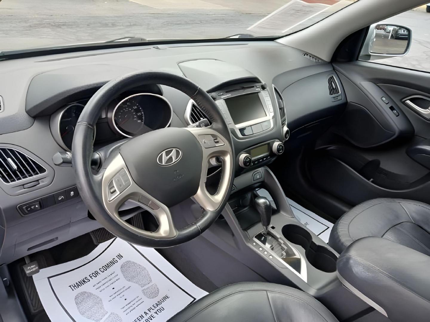 2013 Diamond Silver Metallic Hyundai Tucson Limited 2WD (KM8JU3ACXDU) with an 2.4L L4 DOHC 16V engine, 6-Speed Automatic transmission, located at 401 Woodman Dr, Riverside, OH, 45431, (937) 908-9800, 39.760899, -84.123421 - Photo#6