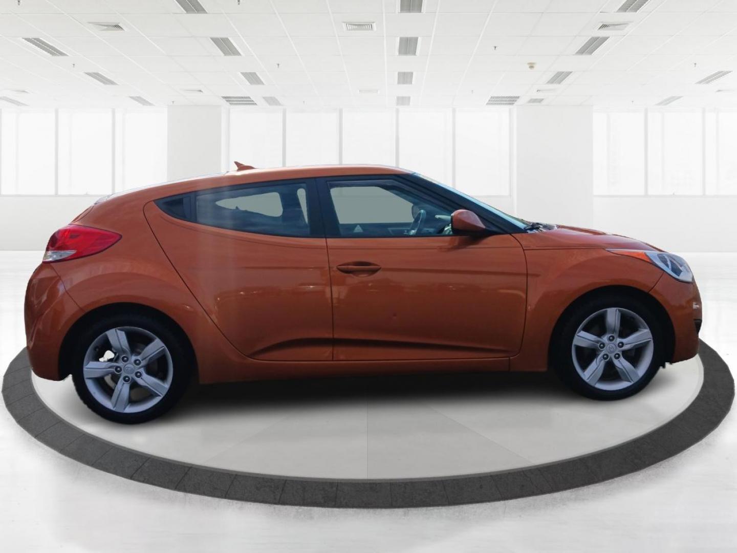 2013 Vitamin C Hyundai Veloster (KMHTC6AD8DU) with an 1.6L L4 DOHC 16V engine, located at 401 Woodman Dr, Riverside, OH, 45431, (937) 908-9800, 39.760899, -84.123421 - Photo#1