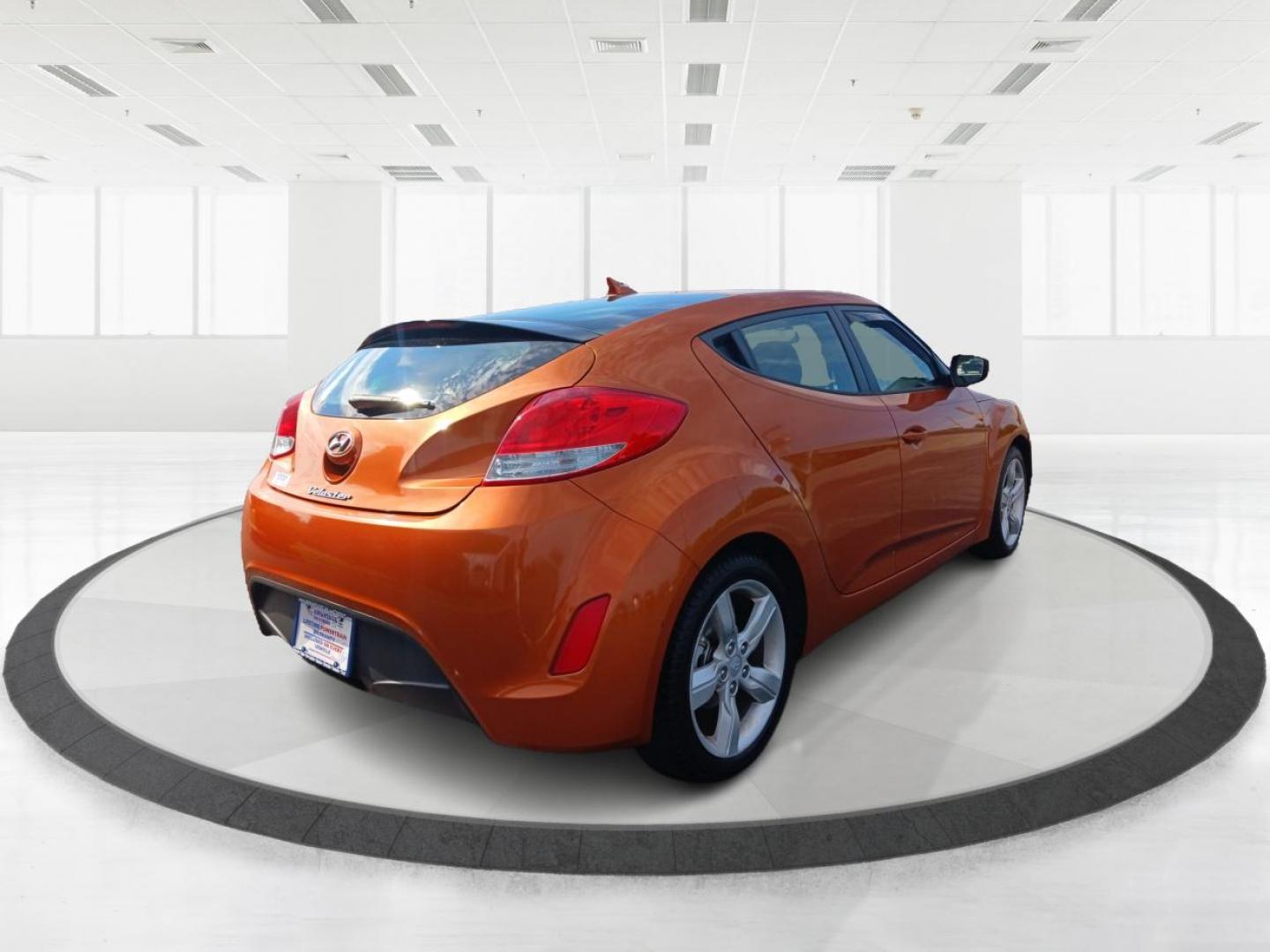 2013 Vitamin C Hyundai Veloster (KMHTC6AD8DU) with an 1.6L L4 DOHC 16V engine, located at 401 Woodman Dr, Riverside, OH, 45431, (937) 908-9800, 39.760899, -84.123421 - Photo#2