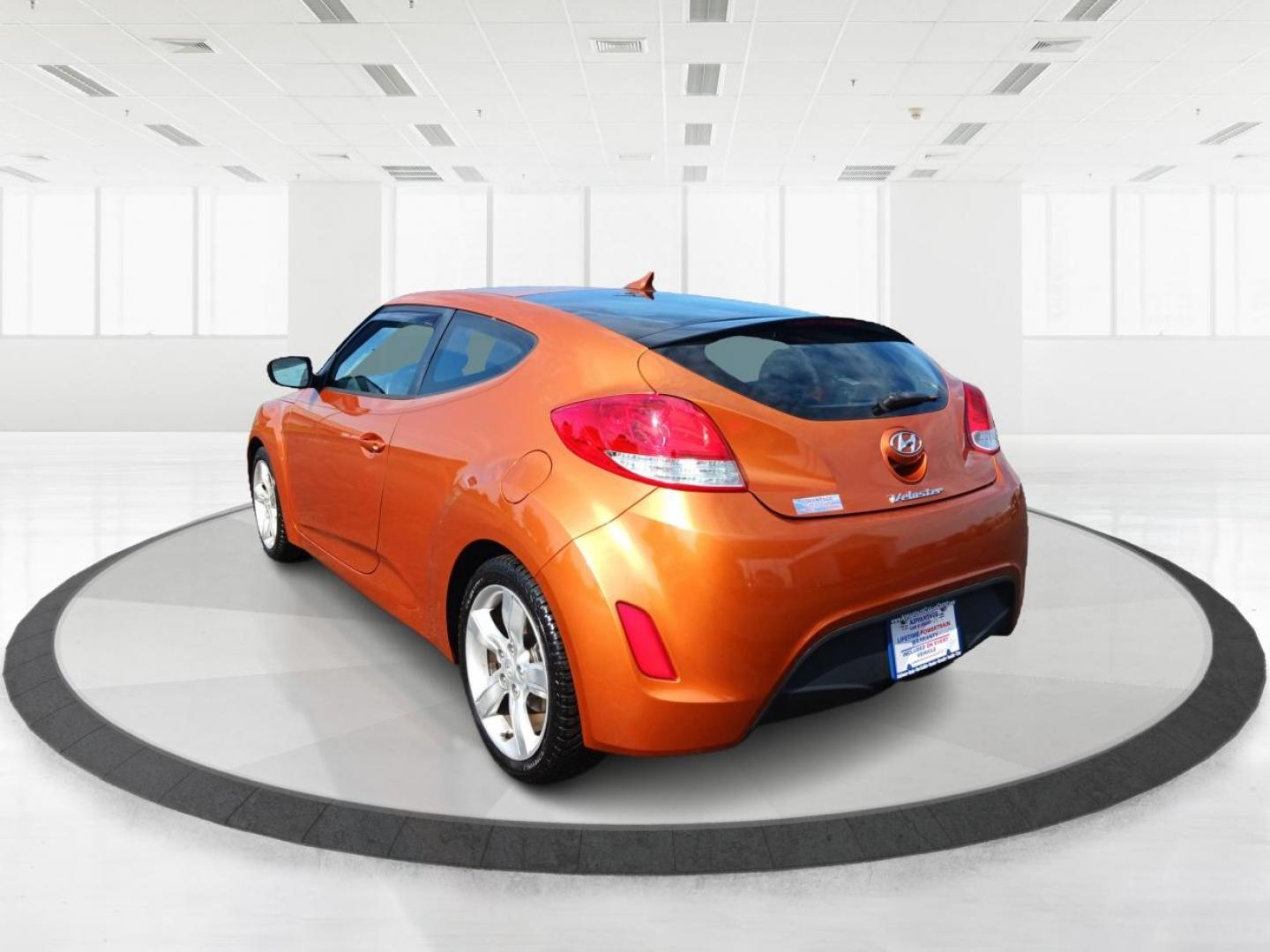 2013 Vitamin C Hyundai Veloster (KMHTC6AD8DU) with an 1.6L L4 DOHC 16V engine, located at 401 Woodman Dr, Riverside, OH, 45431, (937) 908-9800, 39.760899, -84.123421 - Photo#4