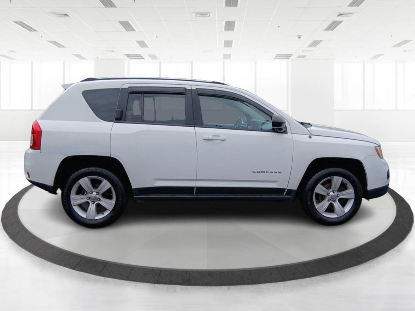 2013 Winter Chill Pearlcoat Jeep Compass Latitude 4WD (1C4NJDEB5DD) with an 2.4L L4 DOHC 16V engine, Continuously Variable Transmission transmission, located at 880 E. National Road, Vandalia, OH, 45377, (937) 908-9800, 39.891918, -84.183594 - Photo#1