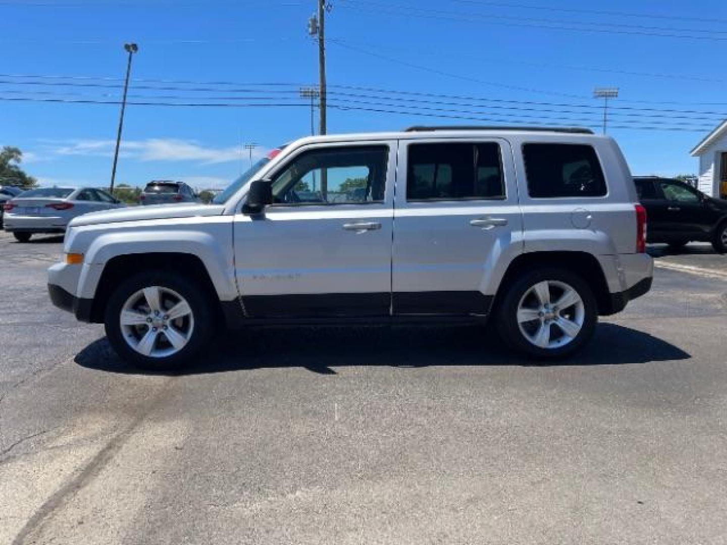 2013 Bright Silver Metallic Jeep Patriot Latitude 2WD (1C4NJPFBXDD) with an 2.4L L4 DOHC 16V engine, located at 1951 S Dayton Lakeview Rd., New Carlisle, OH, 45344, (937) 908-9800, 39.890999, -84.050255 - 2013 Jeep Patriot Latitude 2WD - Photo#15