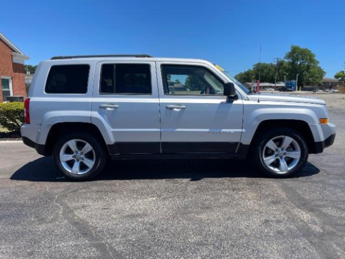 2013 Bright Silver Metallic Jeep Patriot Latitude 2WD (1C4NJPFBXDD) with an 2.4L L4 DOHC 16V engine, located at 1951 S Dayton Lakeview Rd., New Carlisle, OH, 45344, (937) 908-9800, 39.890999, -84.050255 - 2013 Jeep Patriot Latitude 2WD - Photo#16