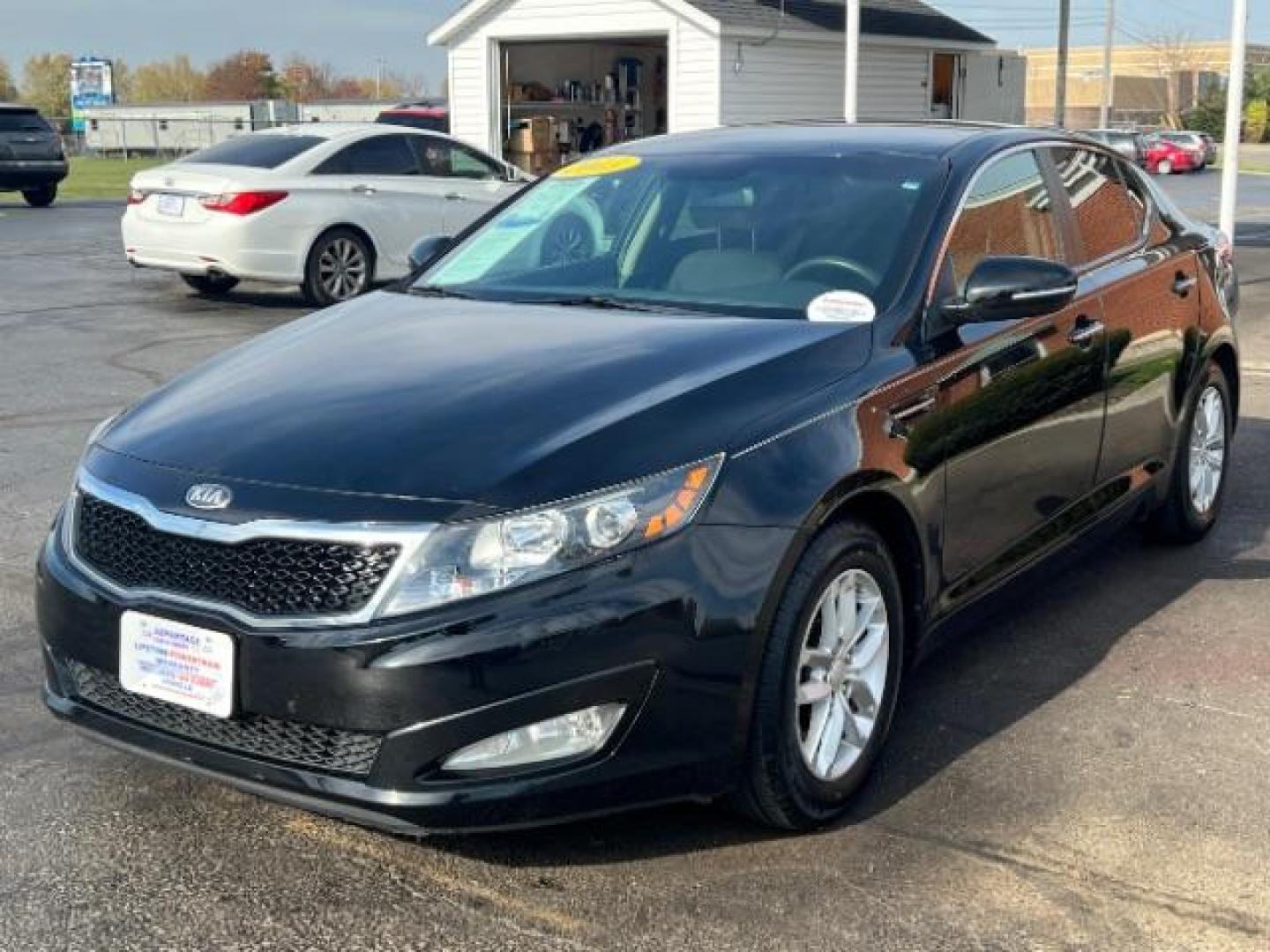 2013 Ebony Black Kia Optima LX AT (5XXGM4A7XDG) with an 2.4L L4 DOHC 16V engine, 6-Speed Automatic transmission, located at 1951 S Dayton Lakeview Rd., New Carlisle, OH, 45344, (937) 908-9800, 39.890999, -84.050255 - Photo#2