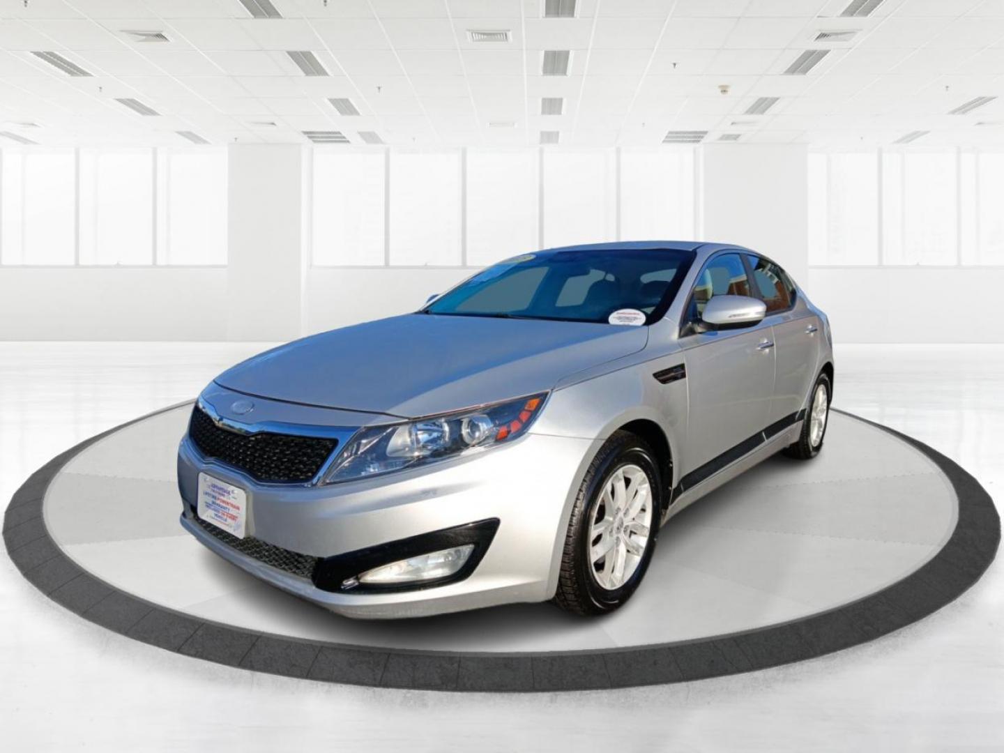 2013 Titanium Metallic Kia Optima LX MT (KNAGM4A76D5) with an 2.4L L4 DOHC 16V engine, 6-Speed Manual transmission, located at 1099 N County Rd 25A , Troy, OH, 45373, (937) 908-9800, 40.057079, -84.212883 - Photo#7