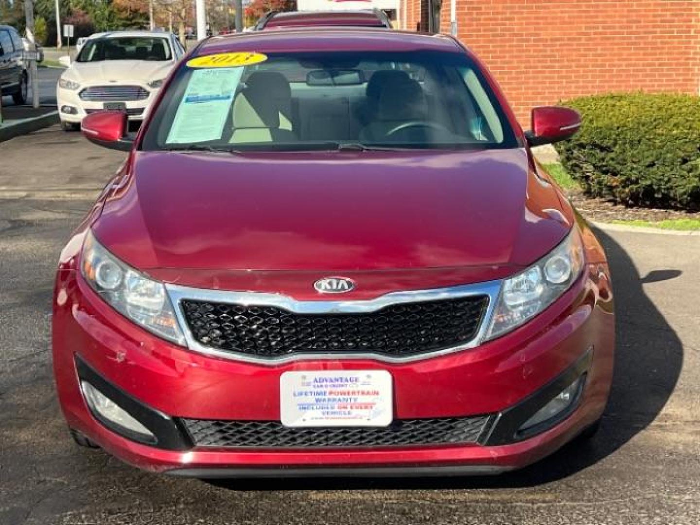 2013 Remington Red Metallic Kia Optima LX AT (5XXGM4A71DG) with an 2.4L L4 DOHC 16V engine, 6-Speed Automatic transmission, located at 1230 East Main St, Xenia, OH, 45385, (937) 908-9800, 39.688026, -83.910172 - Photo#1