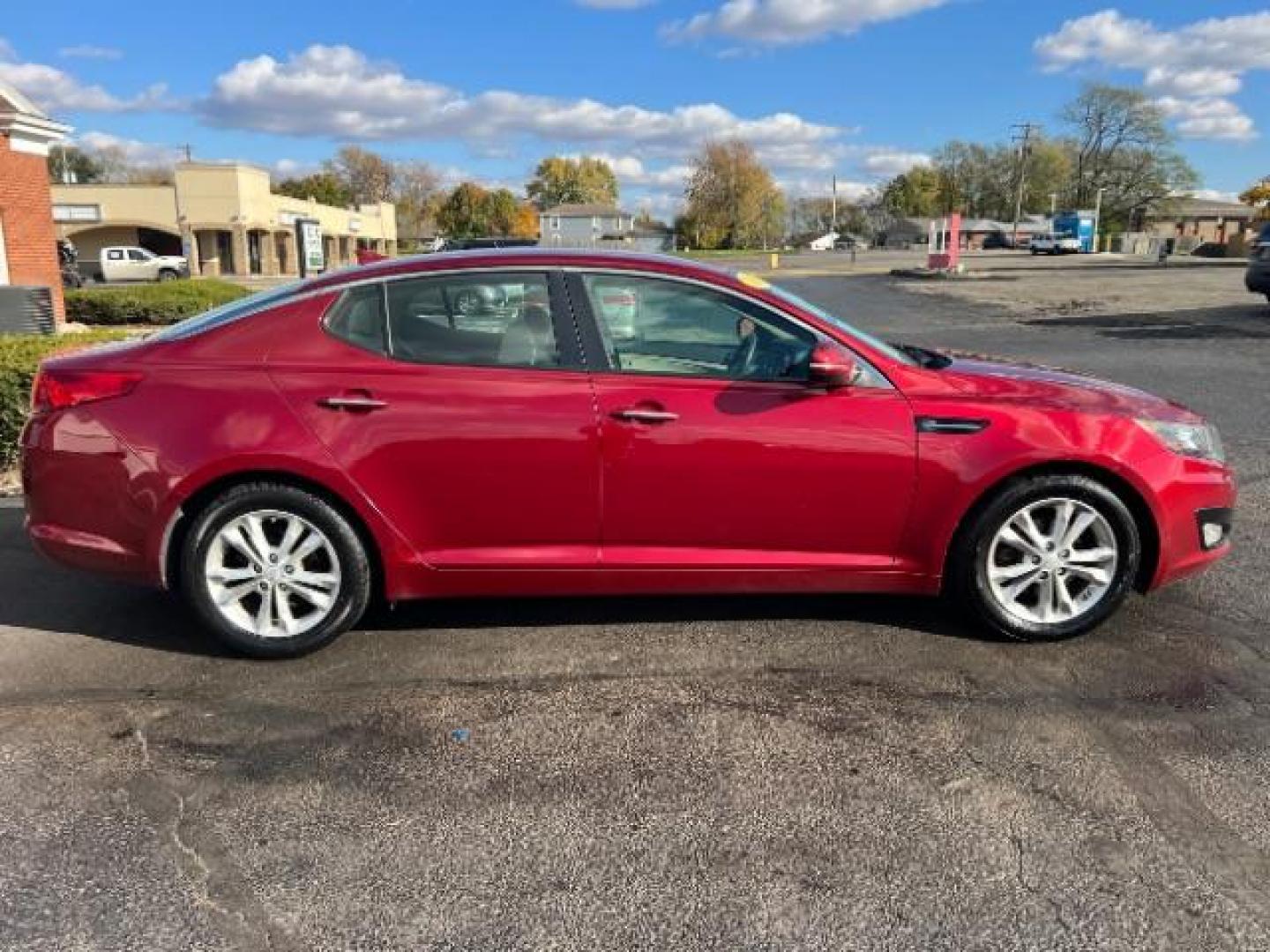 2013 Remington Red Metallic Kia Optima LX AT (5XXGM4A71DG) with an 2.4L L4 DOHC 16V engine, 6-Speed Automatic transmission, located at 1230 East Main St, Xenia, OH, 45385, (937) 908-9800, 39.688026, -83.910172 - Photo#5