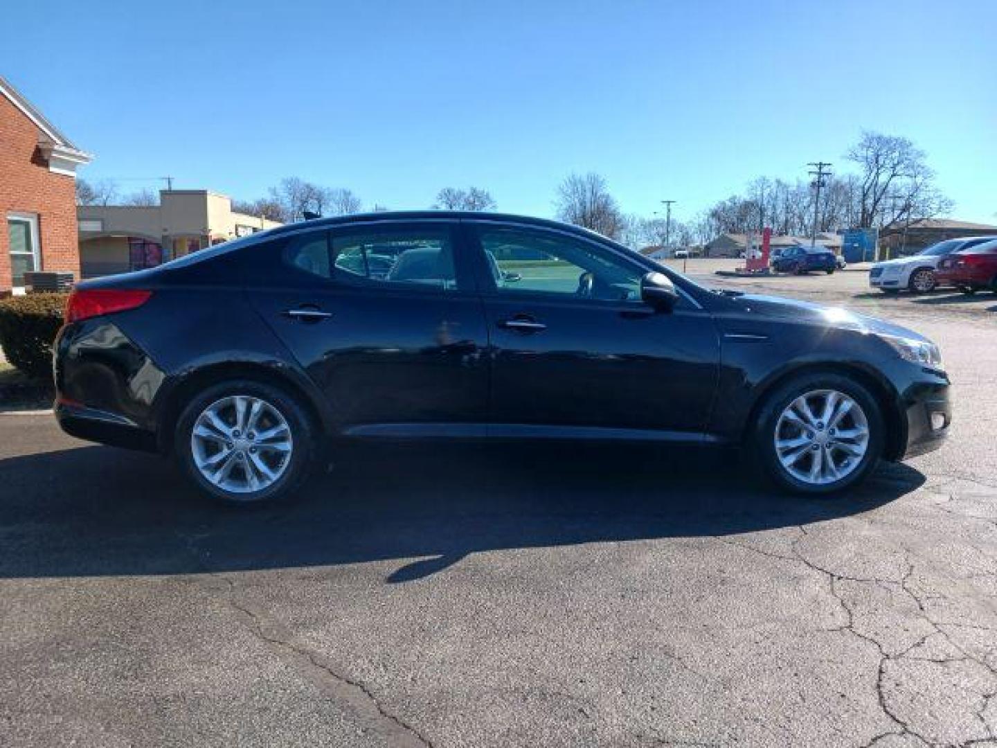 2013 Ebony Black Kia Optima LX AT (5XXGM4A73DG) with an 2.4L L4 DOHC 16V engine, 6-Speed Automatic transmission, located at 1230 East Main St, Xenia, OH, 45385, (937) 908-9800, 39.688026, -83.910172 - Photo#4