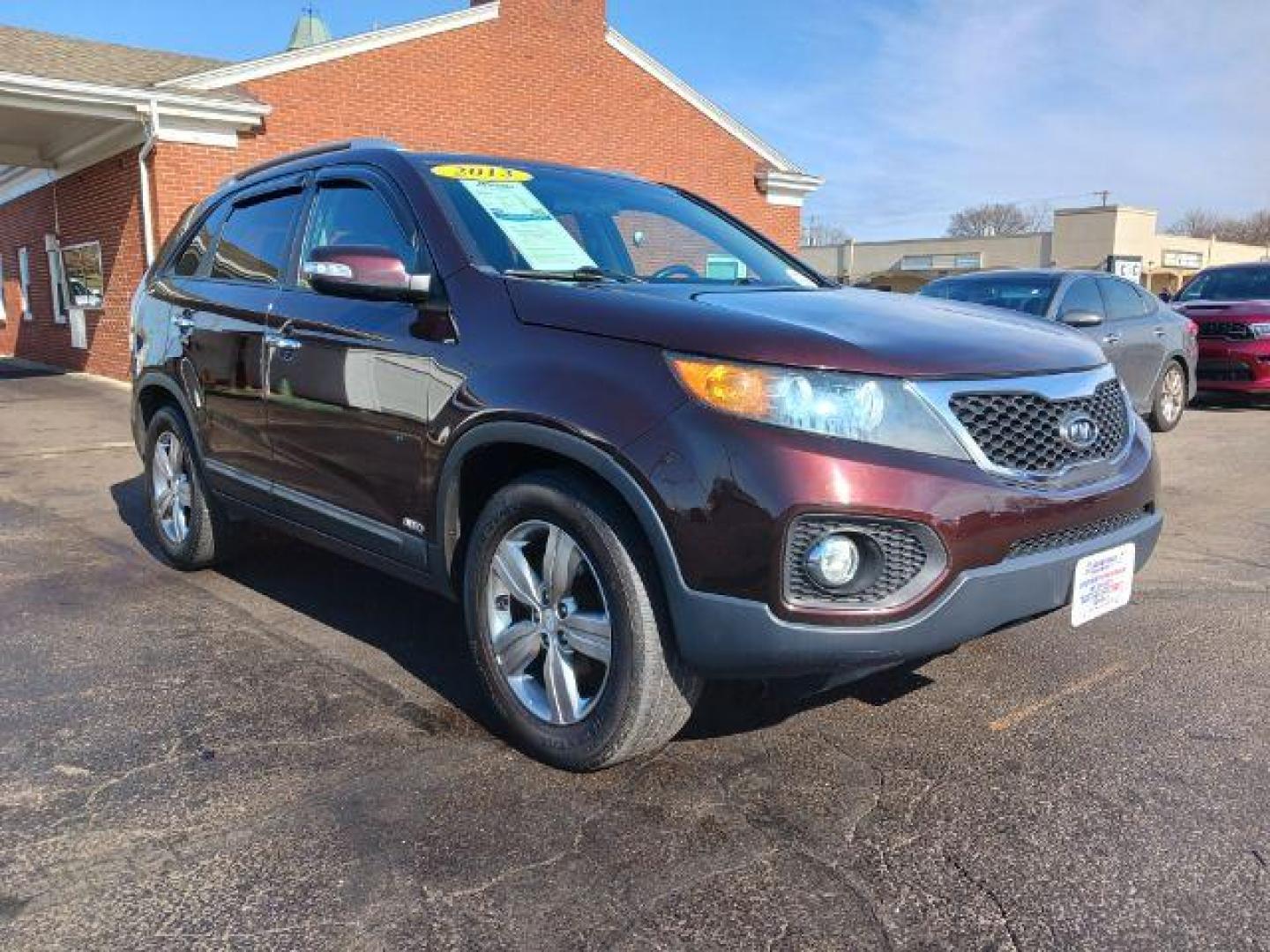 2013 Dark Cherry Kia Sorento EX 4WD (5XYKUCA67DG) with an 2.4L L4 DOHC 16V engine, 6-Speed Automatic transmission, located at 1184 Kauffman Ave, Fairborn, OH, 45324, (937) 908-9800, 39.807072, -84.030914 - Photo#0