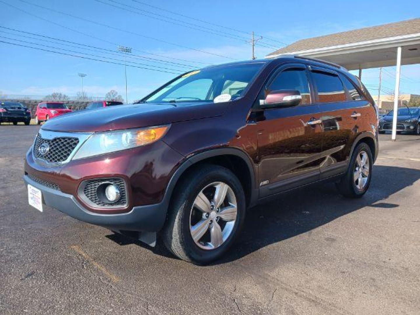 2013 Dark Cherry Kia Sorento EX 4WD (5XYKUCA67DG) with an 2.4L L4 DOHC 16V engine, 6-Speed Automatic transmission, located at 1184 Kauffman Ave, Fairborn, OH, 45324, (937) 908-9800, 39.807072, -84.030914 - Photo#2