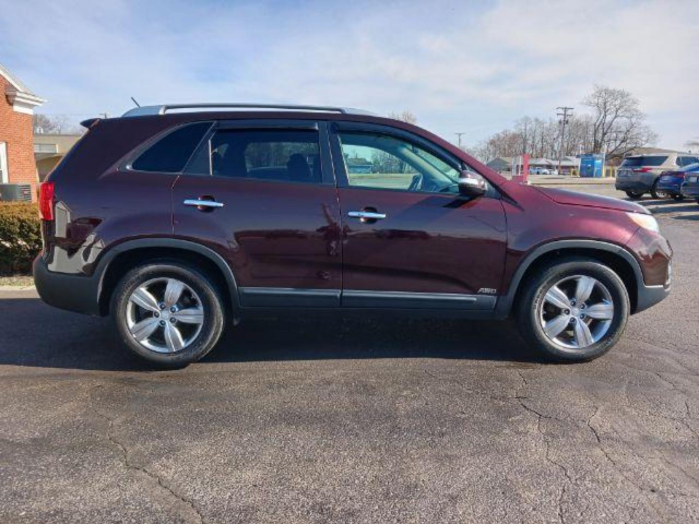 2013 Dark Cherry Kia Sorento EX 4WD (5XYKUCA67DG) with an 2.4L L4 DOHC 16V engine, 6-Speed Automatic transmission, located at 1184 Kauffman Ave, Fairborn, OH, 45324, (937) 908-9800, 39.807072, -84.030914 - Photo#4