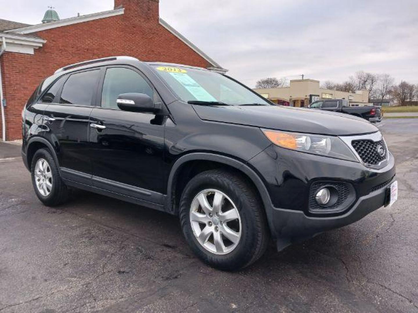 2013 Ebony Black Kia Sorento LX 2WD (5XYKT3A68DG) with an 2.4L L4 DOHC 16V engine, 6-Speed Automatic transmission, located at 401 Woodman Dr, Riverside, OH, 45431, (937) 908-9800, 39.760899, -84.123421 - Photo#0