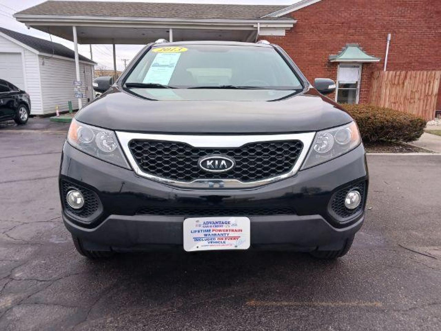 2013 Ebony Black Kia Sorento LX 2WD (5XYKT3A68DG) with an 2.4L L4 DOHC 16V engine, 6-Speed Automatic transmission, located at 401 Woodman Dr, Riverside, OH, 45431, (937) 908-9800, 39.760899, -84.123421 - Photo#1