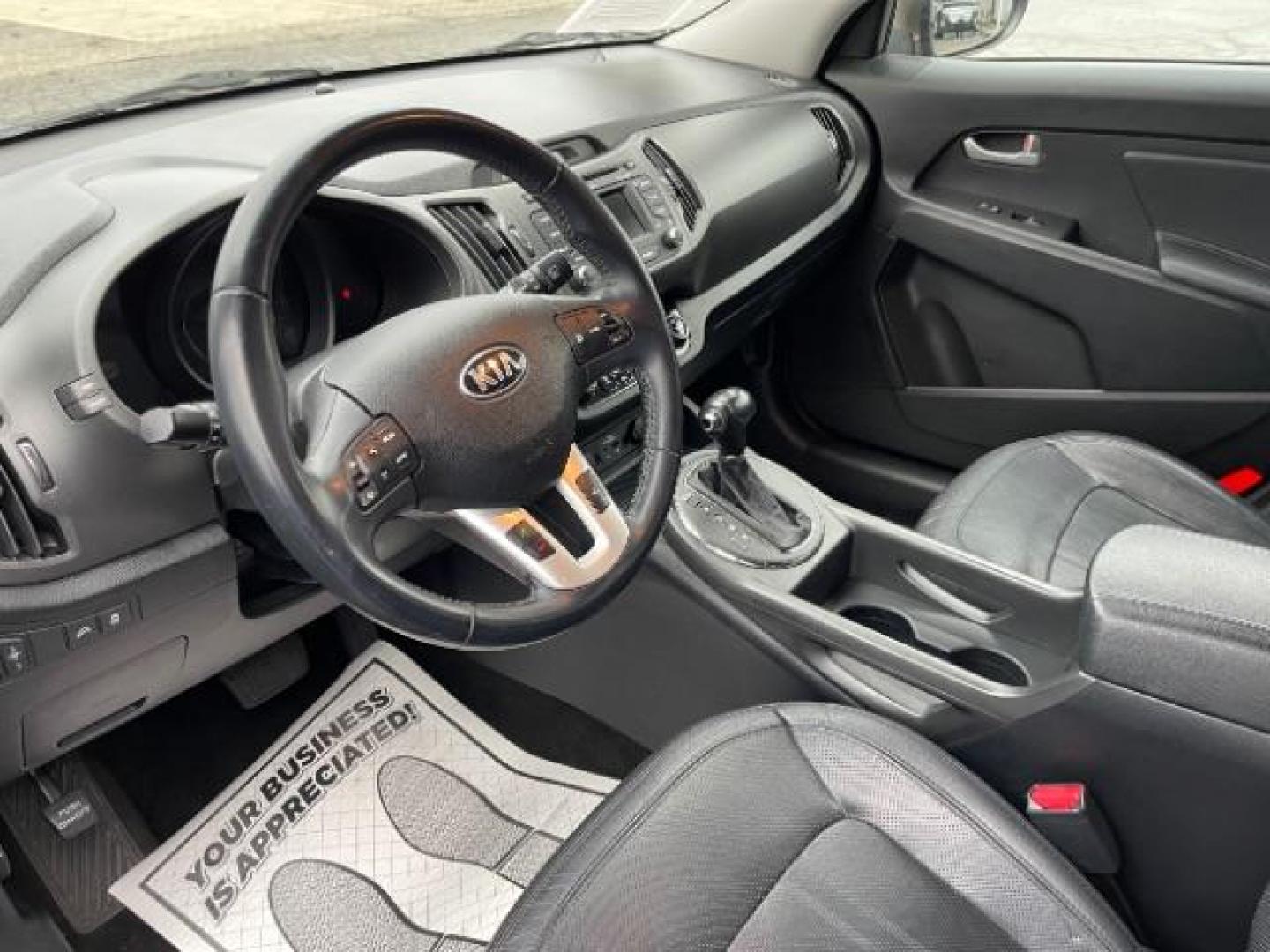 2013 Sand Track Kia Sportage EX FWD (KNDPC3A20D7) with an 2.4L V6 DOHC 24V engine, 6-Speed Automatic transmission, located at 1099 N County Rd 25A , Troy, OH, 45373, (937) 908-9800, 40.057079, -84.212883 - Photo#6