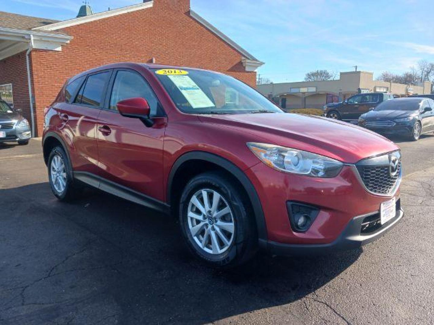 2013 Red Mazda CX-5 Touring AWD (JM3KE4CE4D0) with an 2.0L L4 DOHC 16V engine, 6-Speed Automatic transmission, located at 401 Woodman Dr, Riverside, OH, 45431, (937) 908-9800, 39.760899, -84.123421 - Photo#0