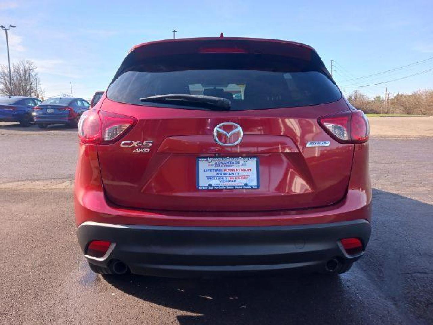 2013 Red Mazda CX-5 Touring AWD (JM3KE4CE4D0) with an 2.0L L4 DOHC 16V engine, 6-Speed Automatic transmission, located at 401 Woodman Dr, Riverside, OH, 45431, (937) 908-9800, 39.760899, -84.123421 - Photo#5