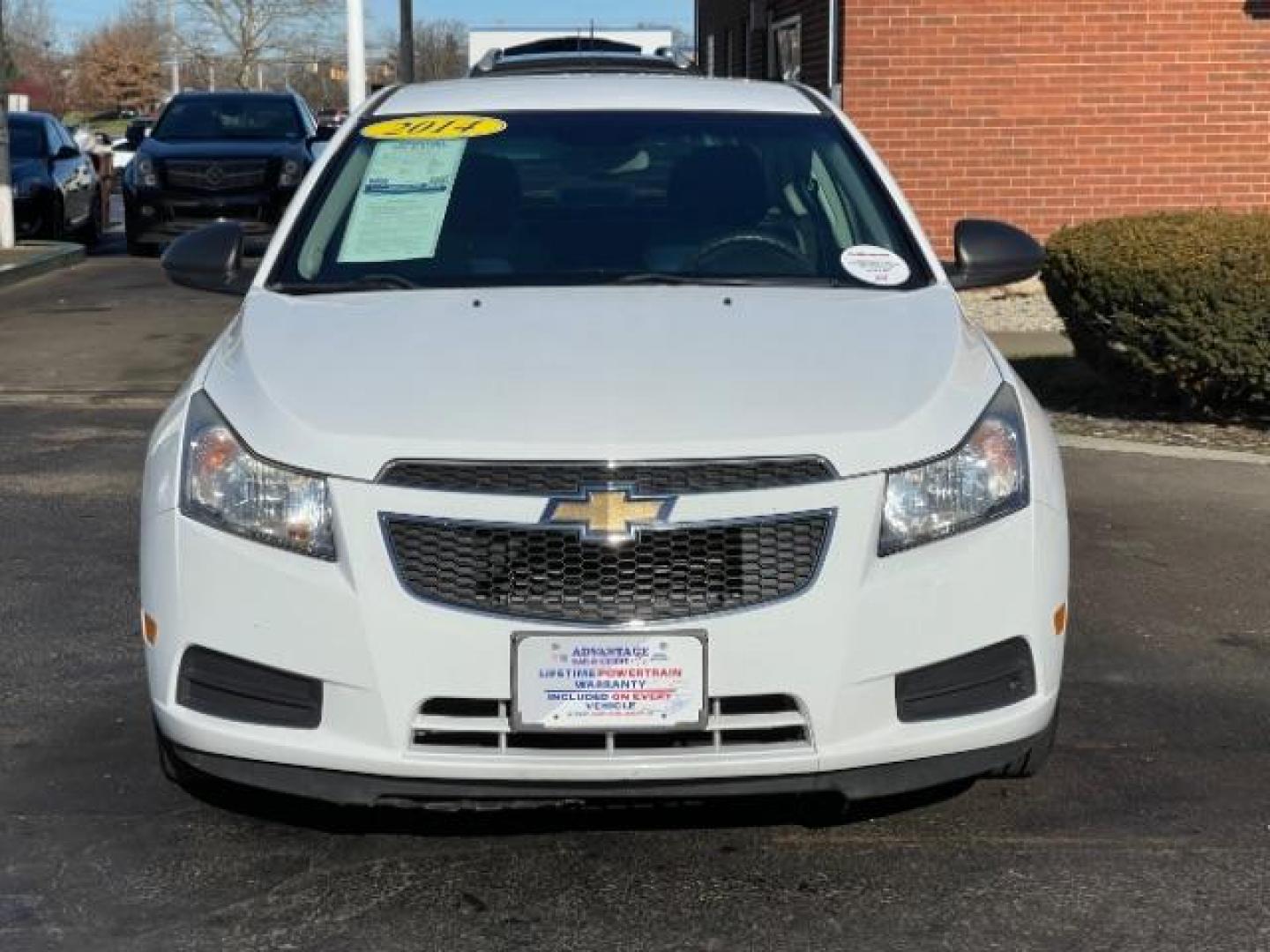 2014 Summit White Chevrolet Cruze LS Auto (1G1PA5SG7E7) with an 1.8L L4 DOHC 16V engine, 6-Speed Automatic transmission, located at 1099 N County Rd 25A , Troy, OH, 45373, (937) 908-9800, 40.057079, -84.212883 - Photo#4