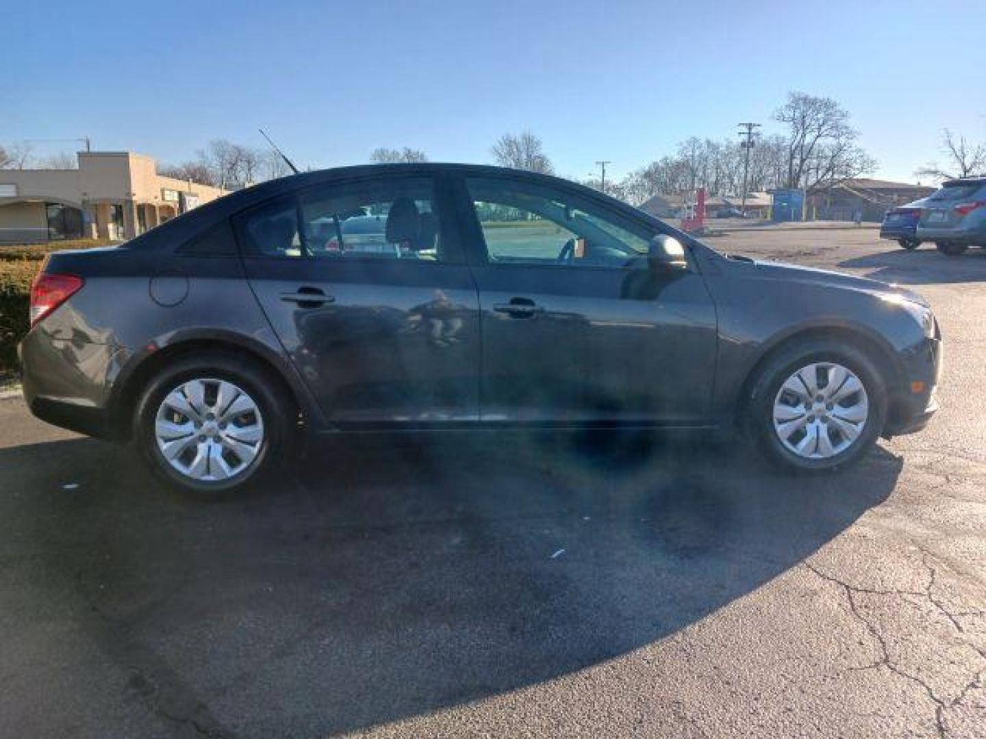 2014 Tungsten Metallic Chevrolet Cruze LS Auto (1G1PA5SH9E7) with an 1.8L L4 DOHC 16V FFV engine, 6-Speed Automatic transmission, located at 4508 South Dixie Dr, Moraine, OH, 45439, (937) 908-9800, 39.689976, -84.218452 - Photo#4