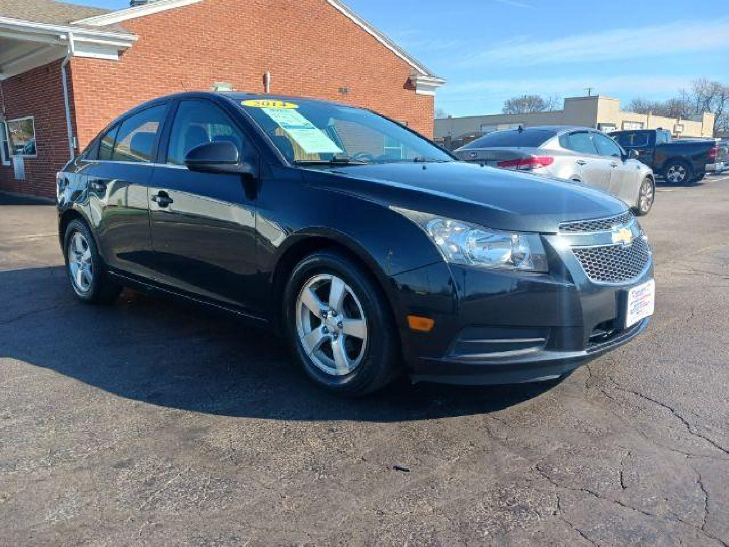 2014 Black Granite Metallic Chevrolet Cruze 1LT Auto (1G1PC5SB2E7) with an 1.4L L4 DOHC 16V TURBO engine, 6-Speed Automatic transmission, located at 4508 South Dixie Dr, Moraine, OH, 45439, (937) 908-9800, 39.689976, -84.218452 - Photo#0